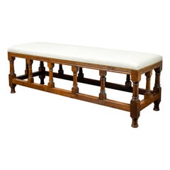 English 1880s Oak Bench with Turned Legs, Side Stretchers and New Upholstery