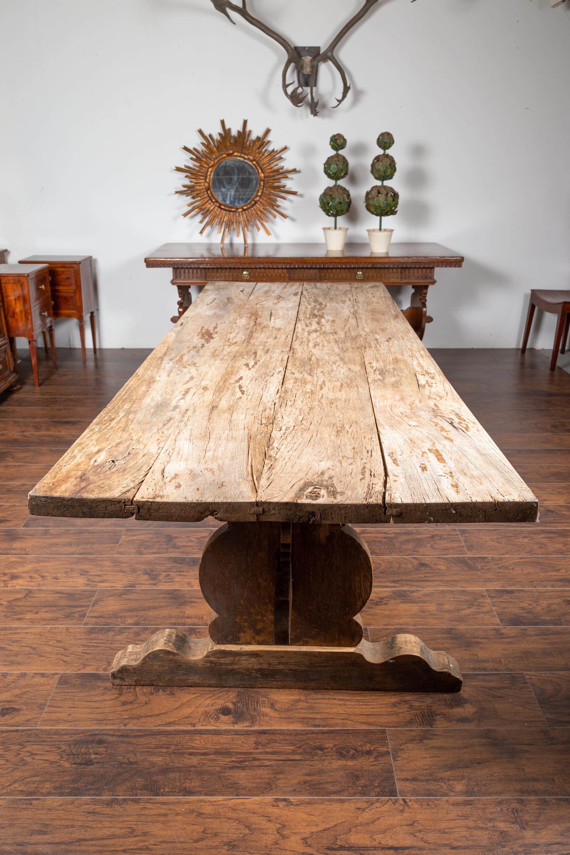 English 1880s Oak Farm Dining Table with Carved Trestle Base and Aged Patina 4