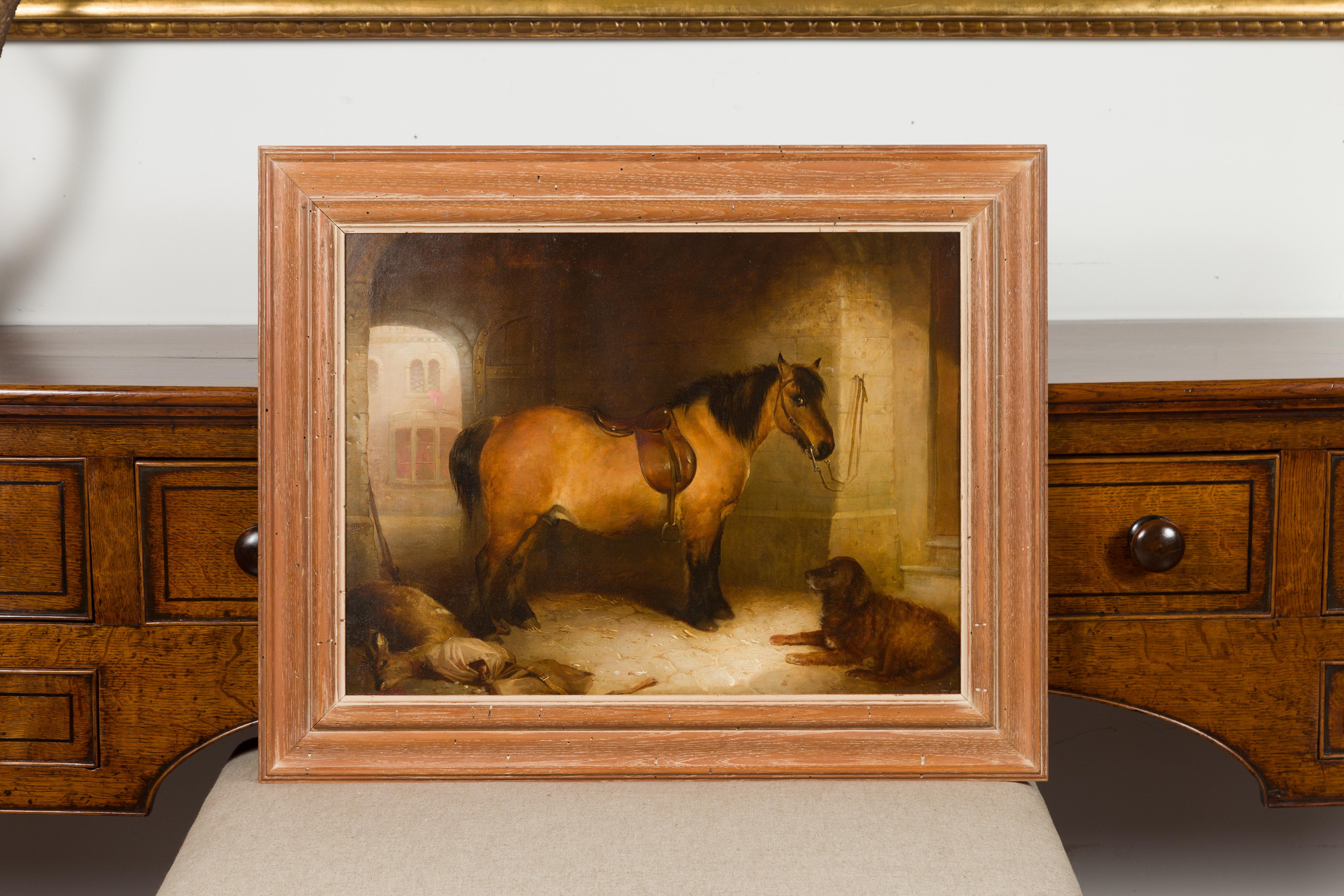 An English late 19th century oil on canvas painting from the circle of Landseer, depicting a horse and a dog in a stable. Created in England during the last quarter of the 19th century, this oil on canvas painting attracts our attention with its