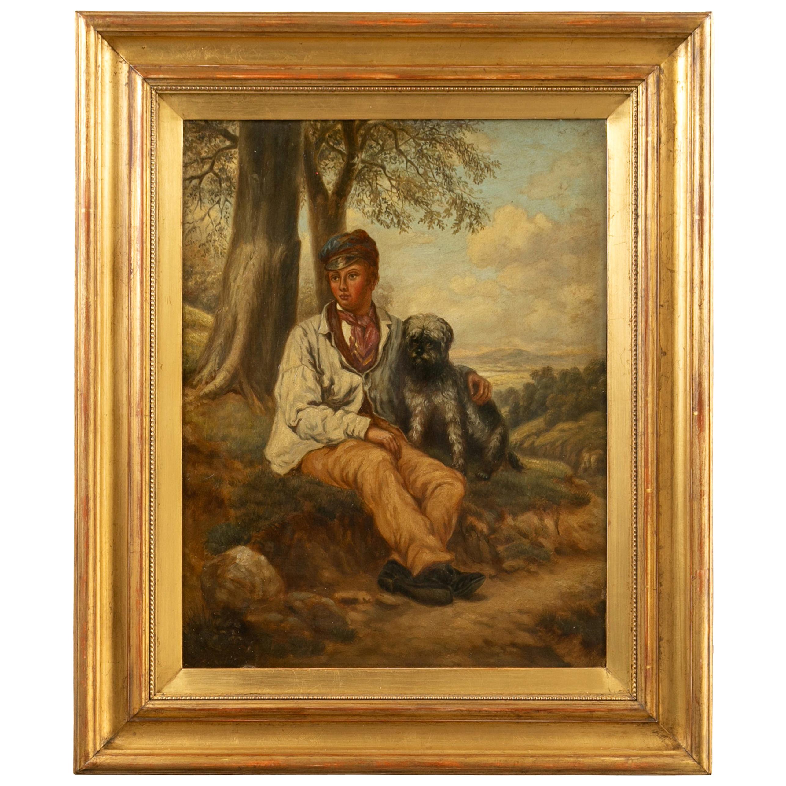 Huile sur toile anglaise des années 1880 représentant un garçon et son chien dans un cadre doré ancien