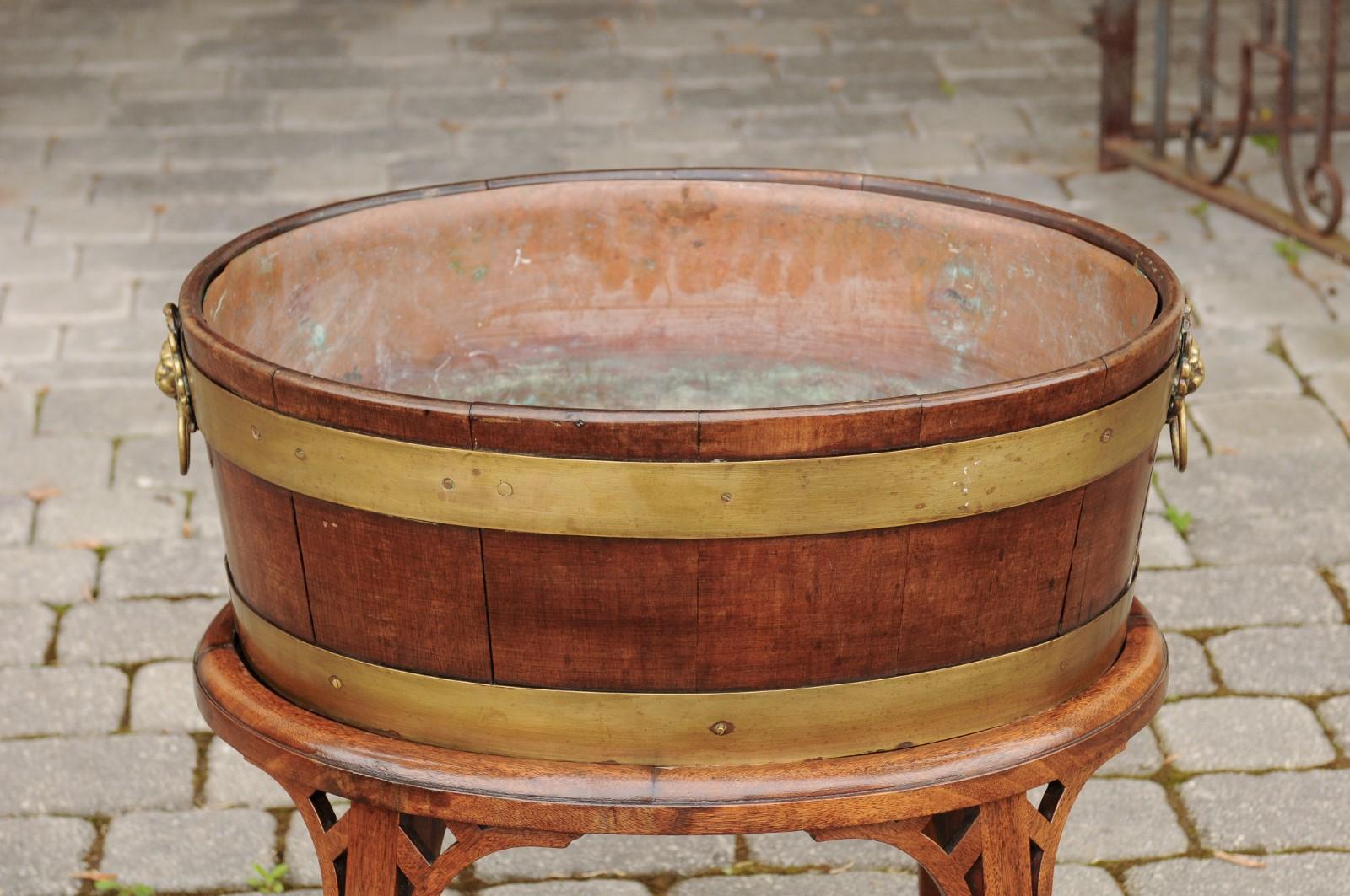 English 1880s Oval Oak Planter with Brass Braces Mounted on Custom Oak Stand For Sale 4