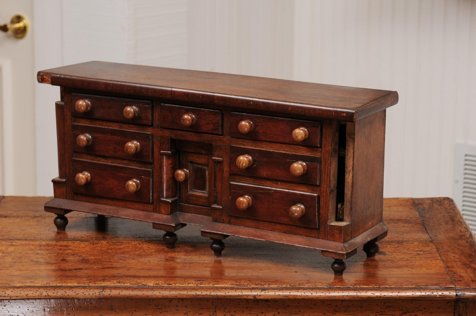 English 1890s Miniature Chest with Seven Drawers, Semi Columns and Turnip Feet 11
