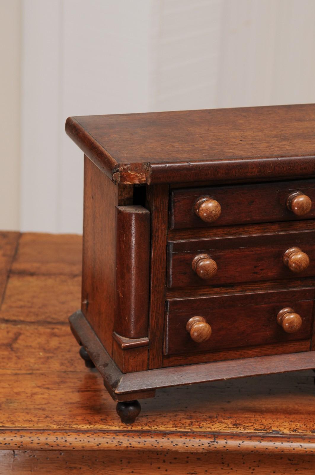 19th Century English 1890s Miniature Chest with Seven Drawers, Semi Columns and Turnip Feet