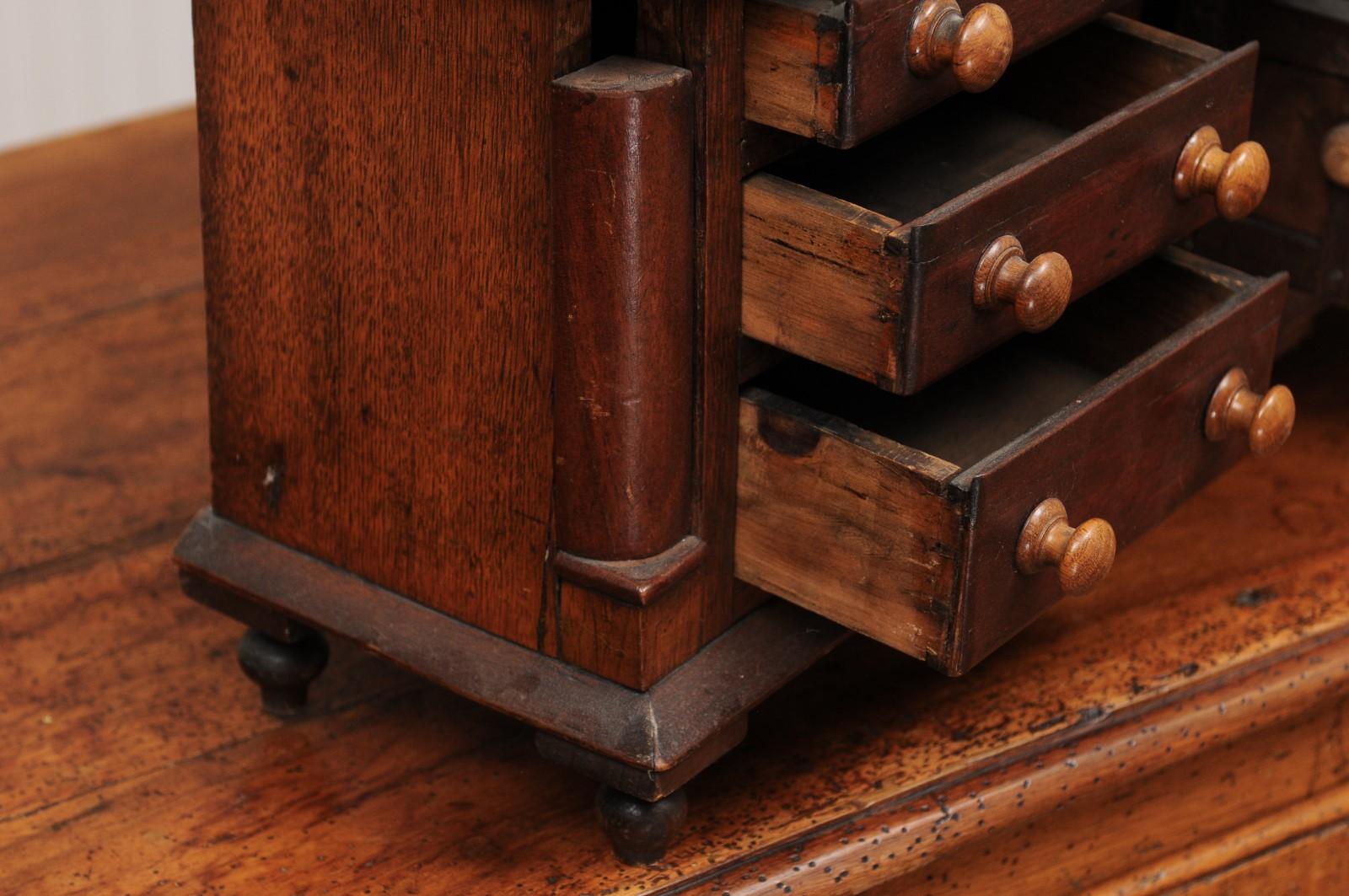 English 1890s Miniature Chest with Seven Drawers, Semi Columns and Turnip Feet 2