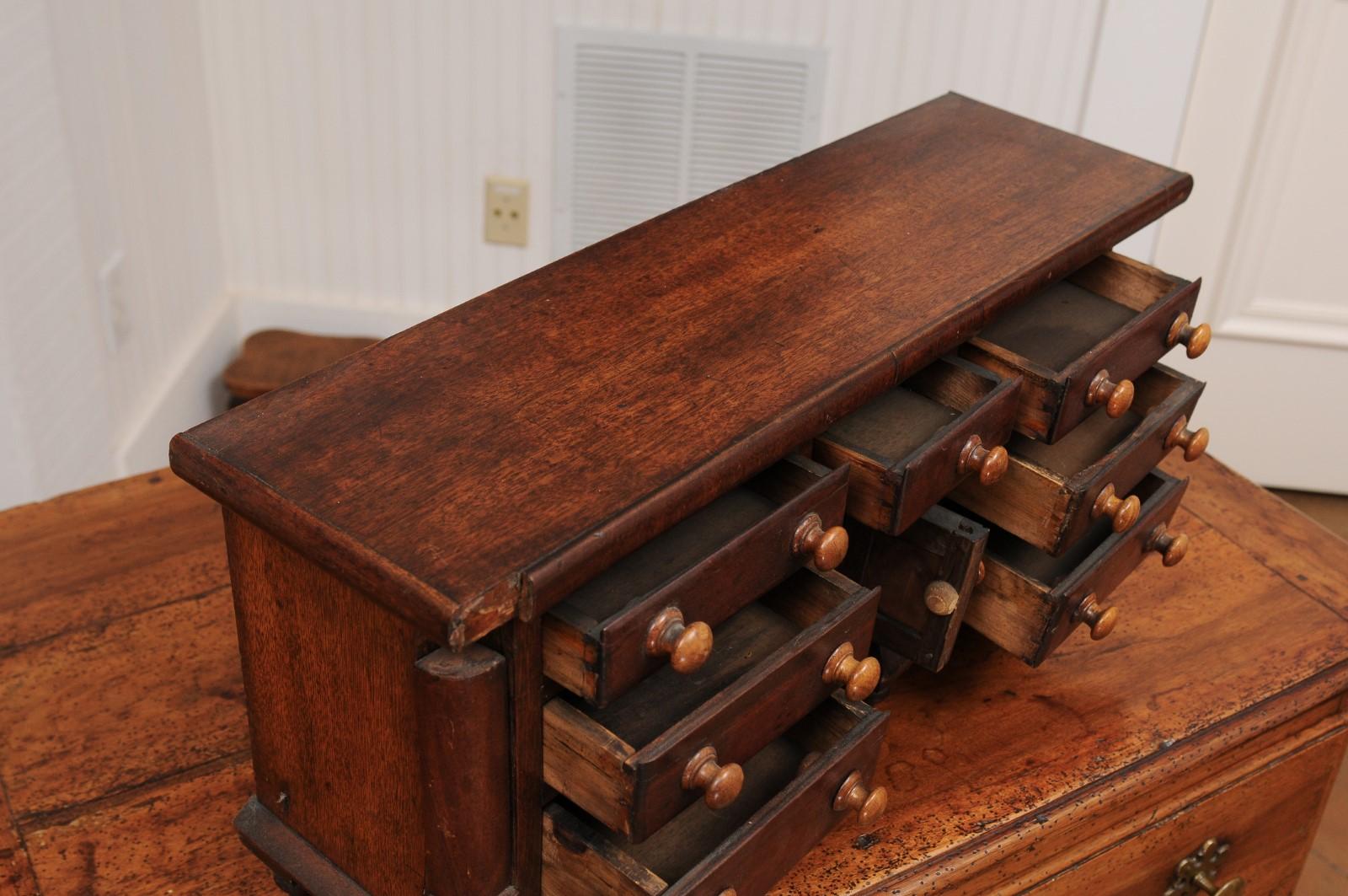 English 1890s Miniature Chest with Seven Drawers, Semi Columns and Turnip Feet 3