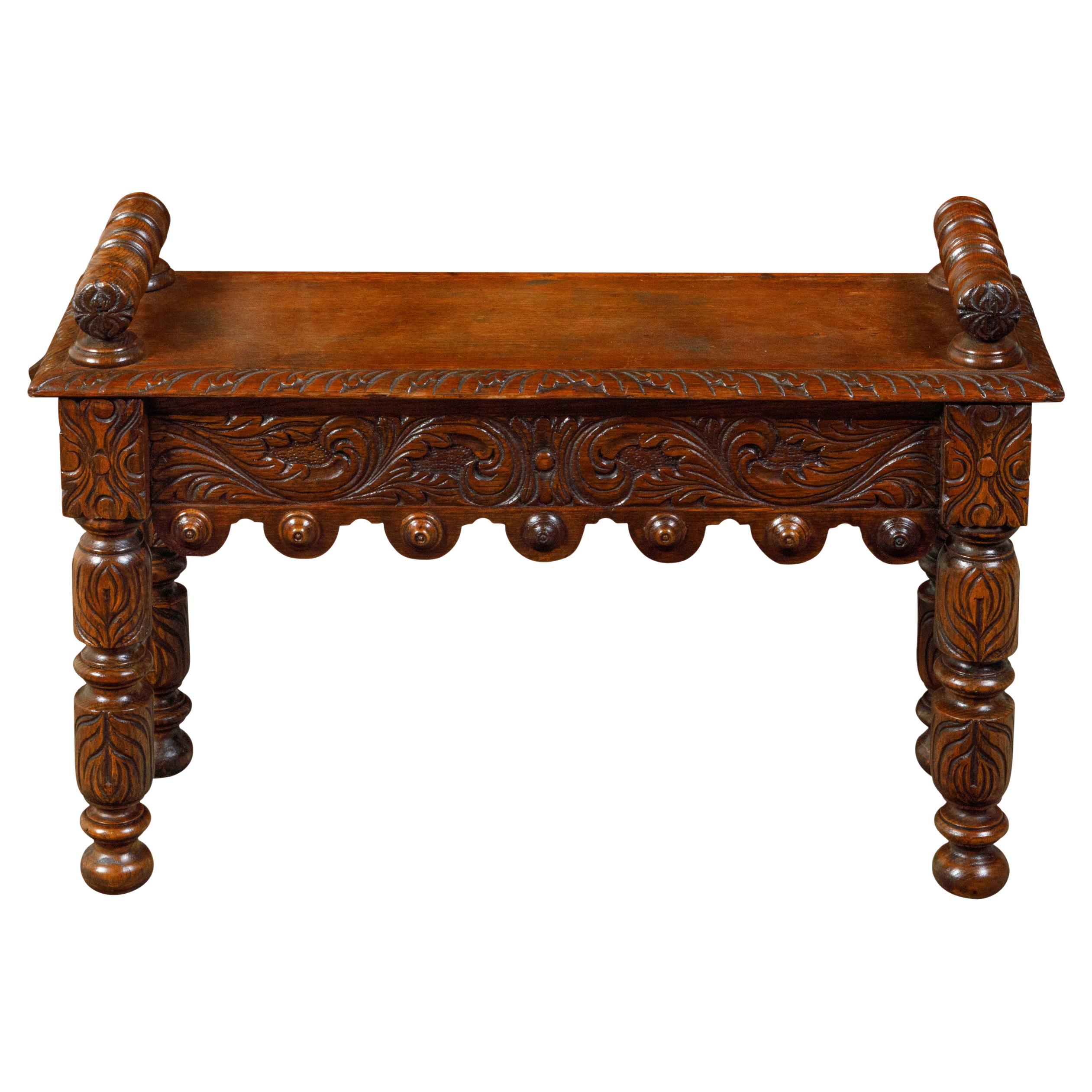 English 1890s Oak Hall Bench with Cylindrical Armrests and Carved Apron For Sale