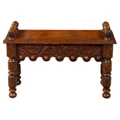 Antique English 1890s Oak Hall Bench with Cylindrical Armrests and Carved Apron