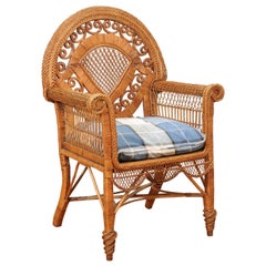 Antique English 1890s Wicker Chair with Intricate Back, Scrolling Arms and New Cushion