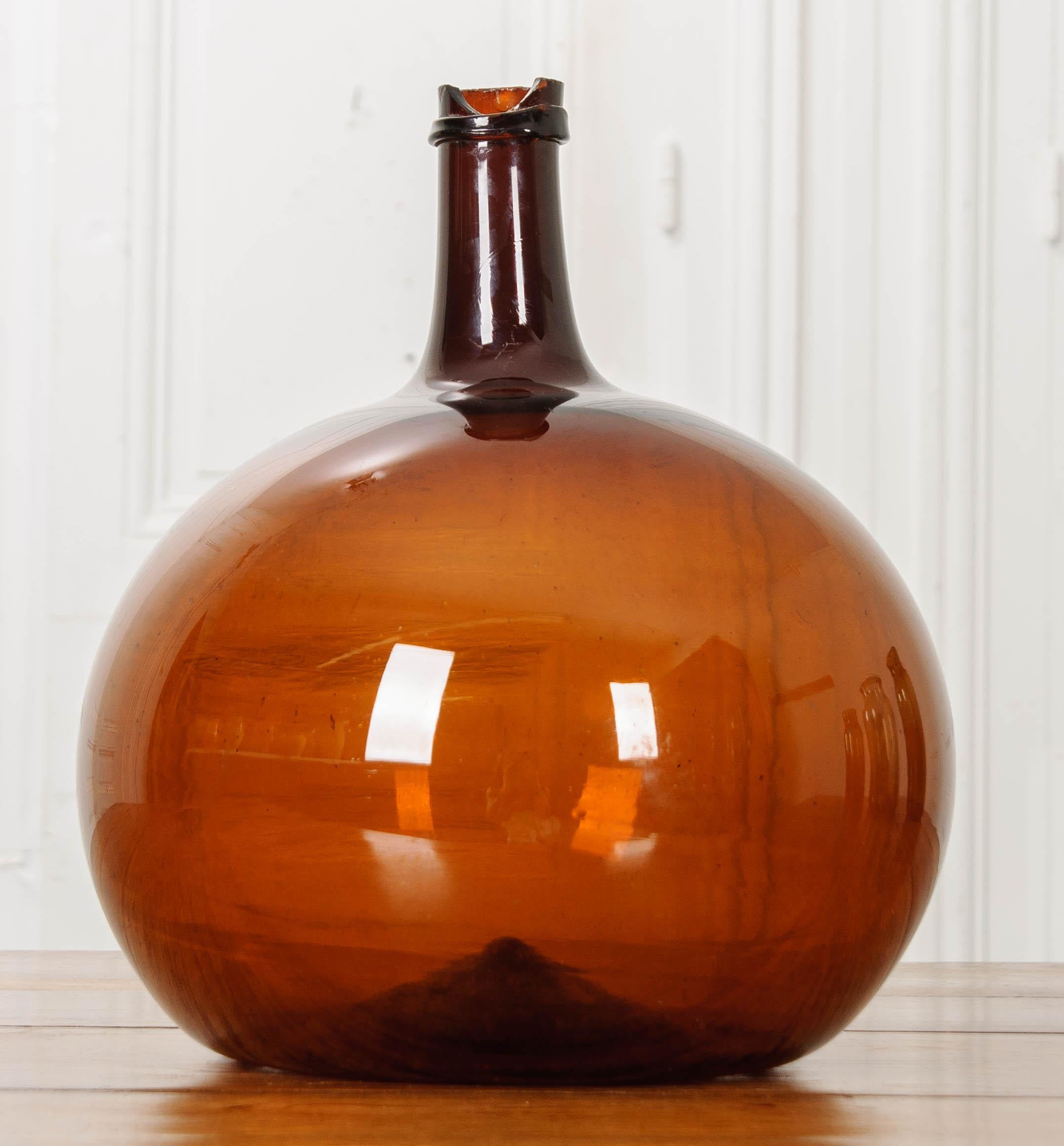 Before the days of individually bottled wine, and even longer before boxed wine, oenophiles (wine lovers) would fill large glass kegs from a merchant and brought home for consumption. This smaller wine keg was made in England, circa 1790 of