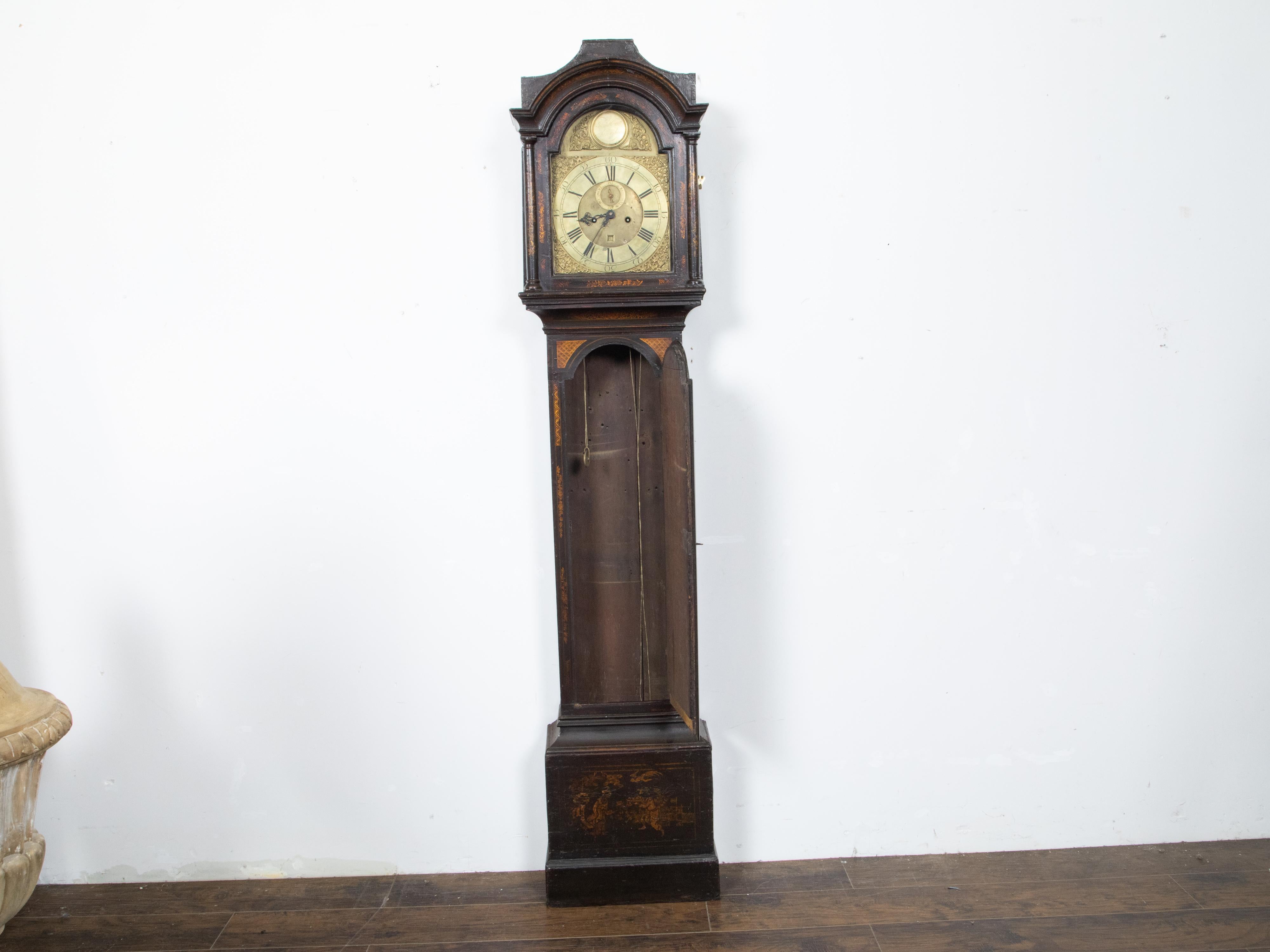 An English George III period tall case clock from the mid 18th century, with chinoiserie décor and brass face by James Hewitt of Sunderland. Created in England during the reign of King George III period in the third quarter of the 18th century, this