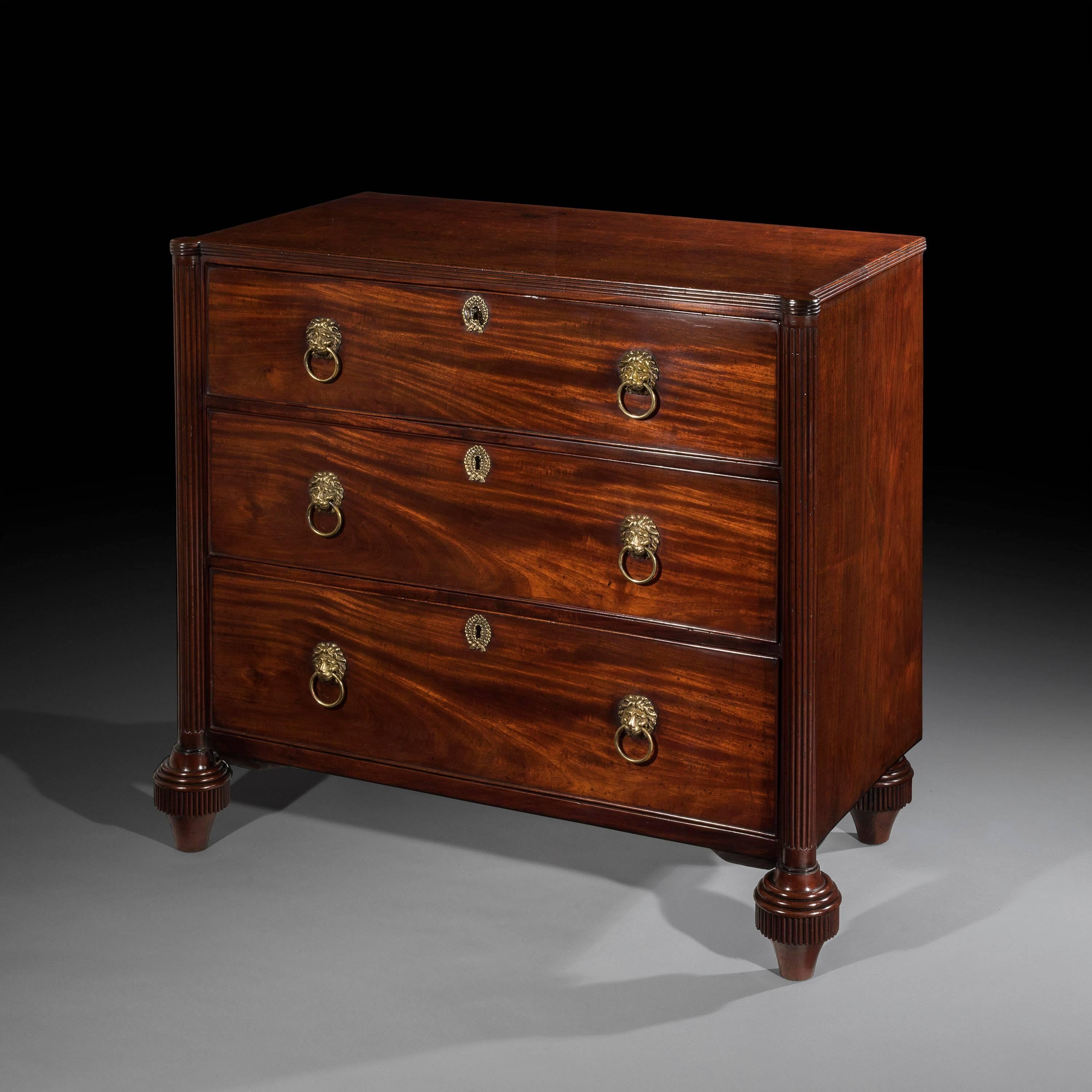 An unusual and rare late 18th century George III period mahogany architectural chest of three drawers in the neoclassical sheraton taste, in the manner of Gillows of Lancaster and London, English, circa 1790.

The rectangular top, with a reeded