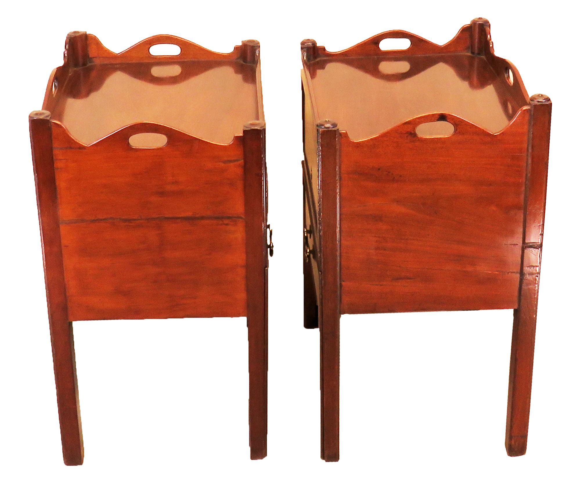 An exceptionally well matched pair of 18th century mahogany
Bedside night tables, or tray top commodes, of good color
And patina having shaped gallery tops over well figured up
And over doors and converted drawers raised on square
Chamfered