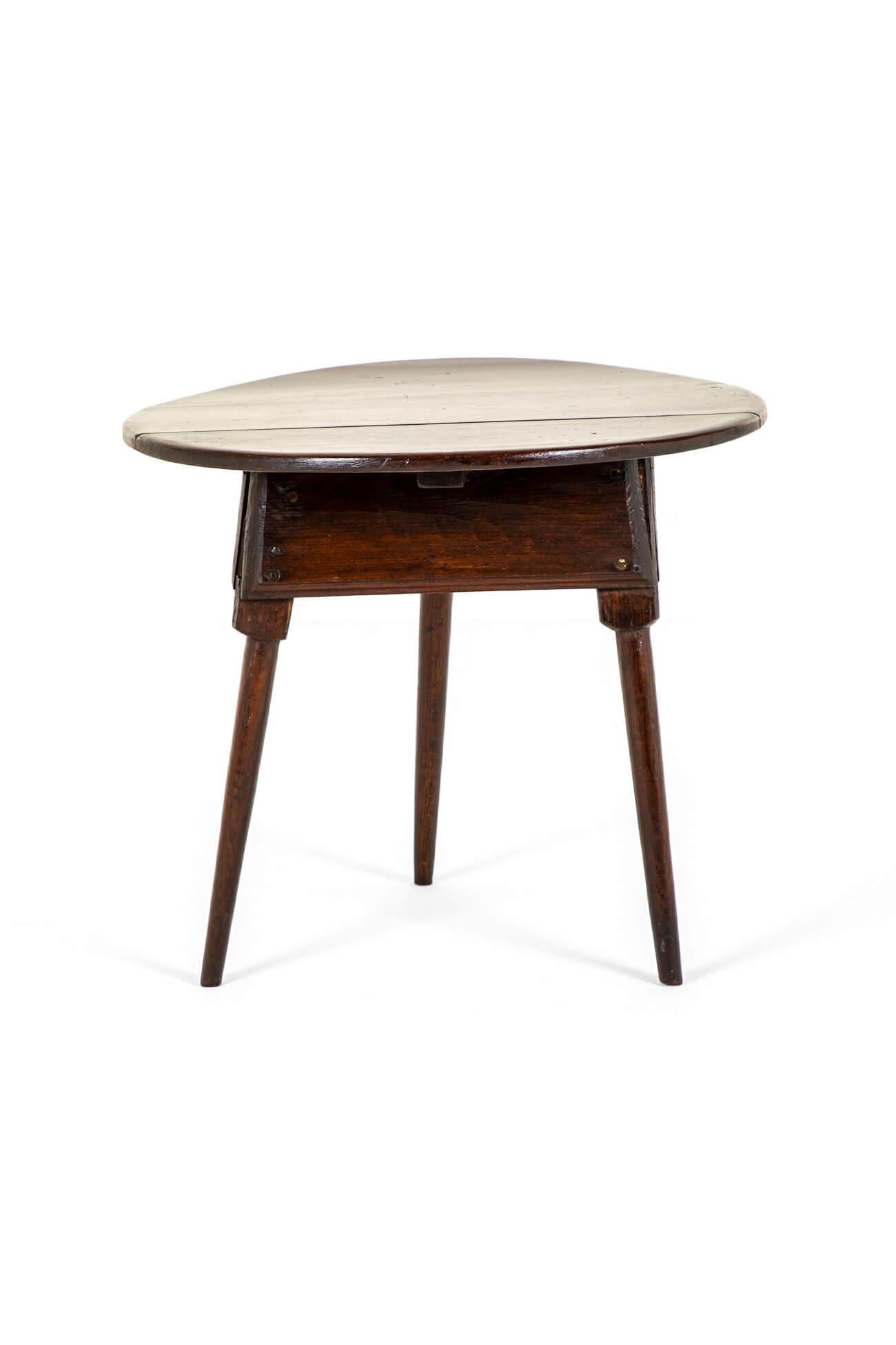 A wonderful 18th century oak cricket table with a rustic weathered three plank circular top.

The table is raised on square tapering legs pegged to a square apron.

Historical fixes throughout only had to the charm of this vernacular piece of