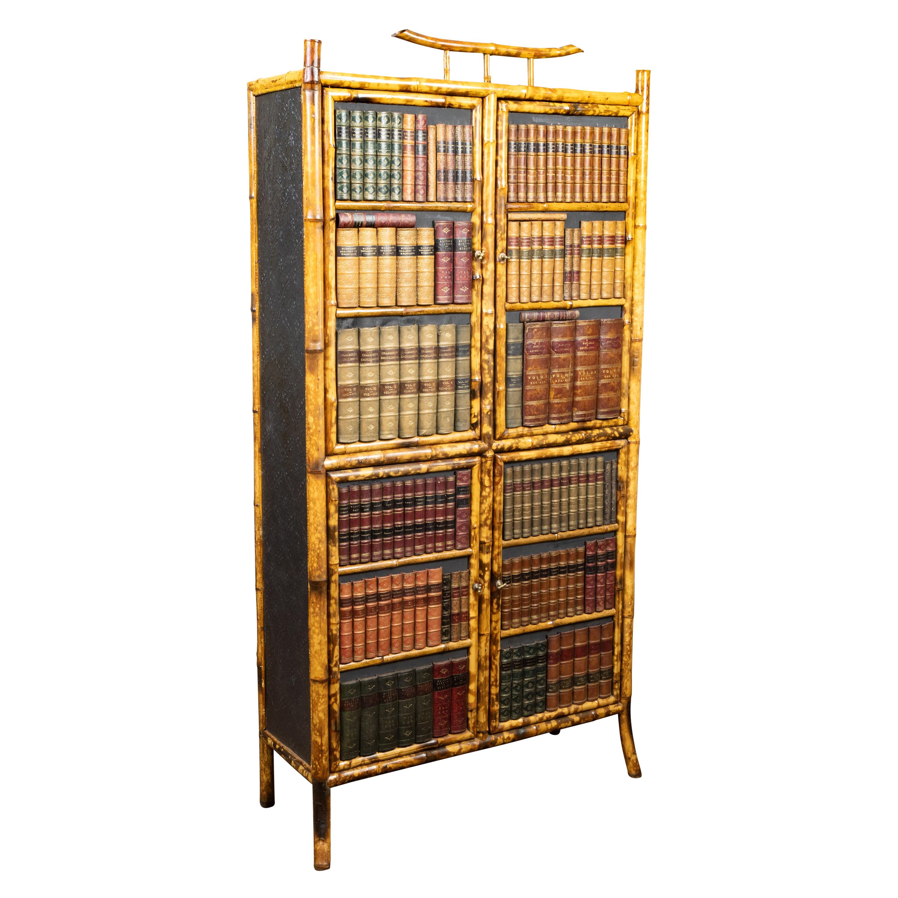 English 1900s Bamboo Cabinet with Faux Books Façade and Splaying Legs For Sale