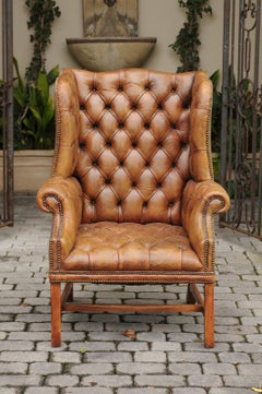 English 1900s Button-Tufted Leather Wingback Chair with Out-Scrolling Arms
