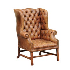 Antique English 1900s Button-Tufted Leather Wingback Chair with Out-Scrolling Arms