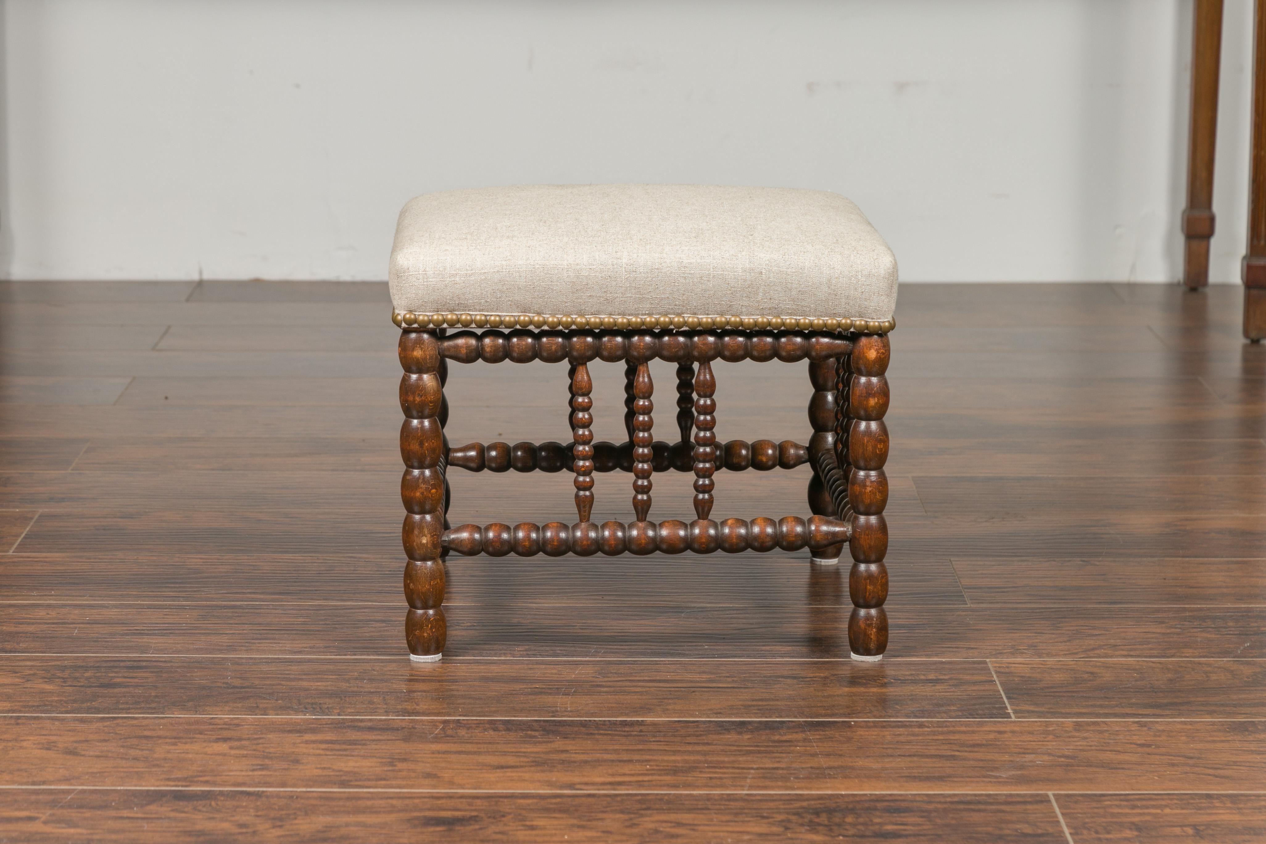 English 1900s Oak Footstool with Bobbin Legs, New Upholstery and Nailhead Trim 3