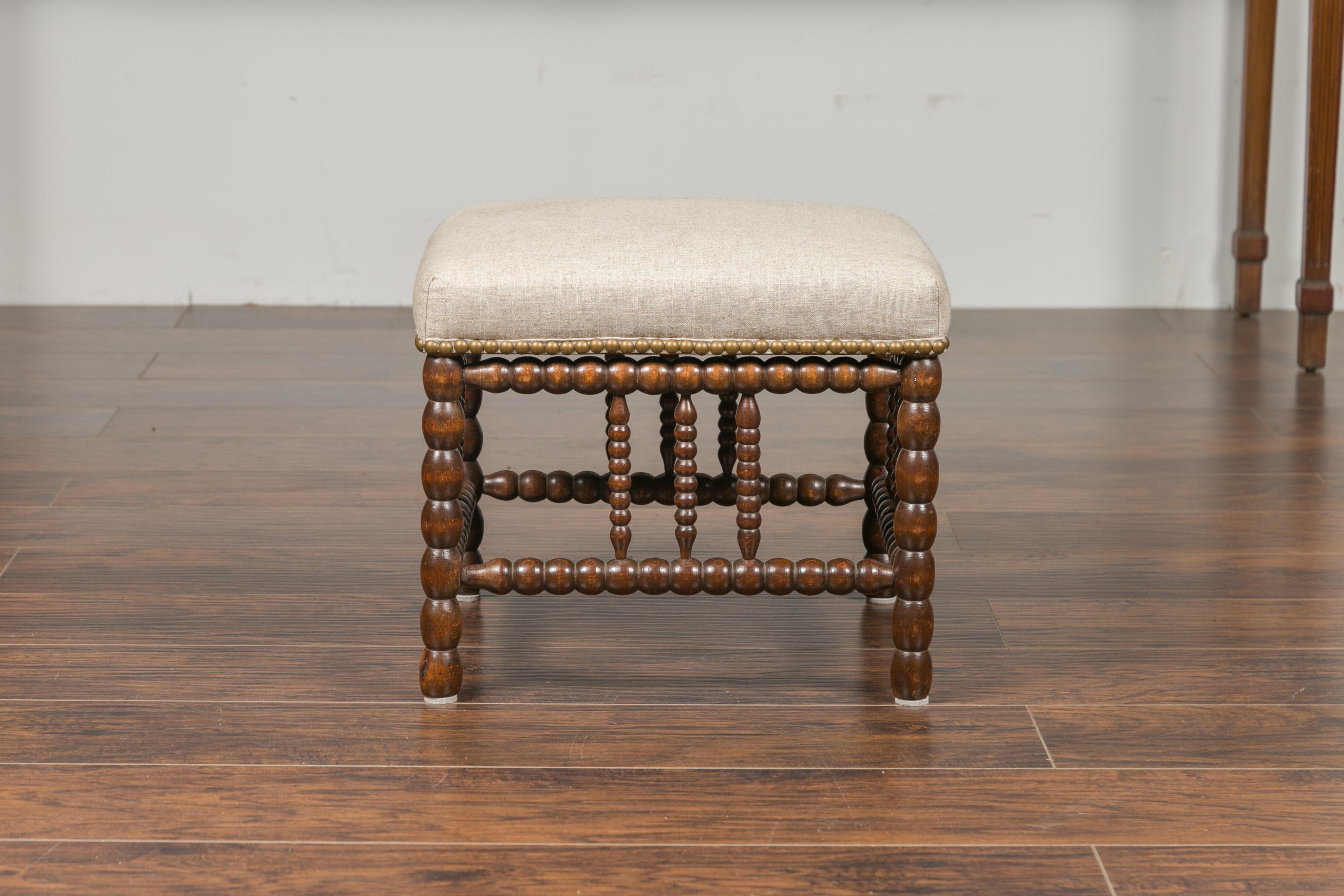 English 1900s Oak Footstool with Bobbin Legs, New Upholstery and Nailhead Trim 4