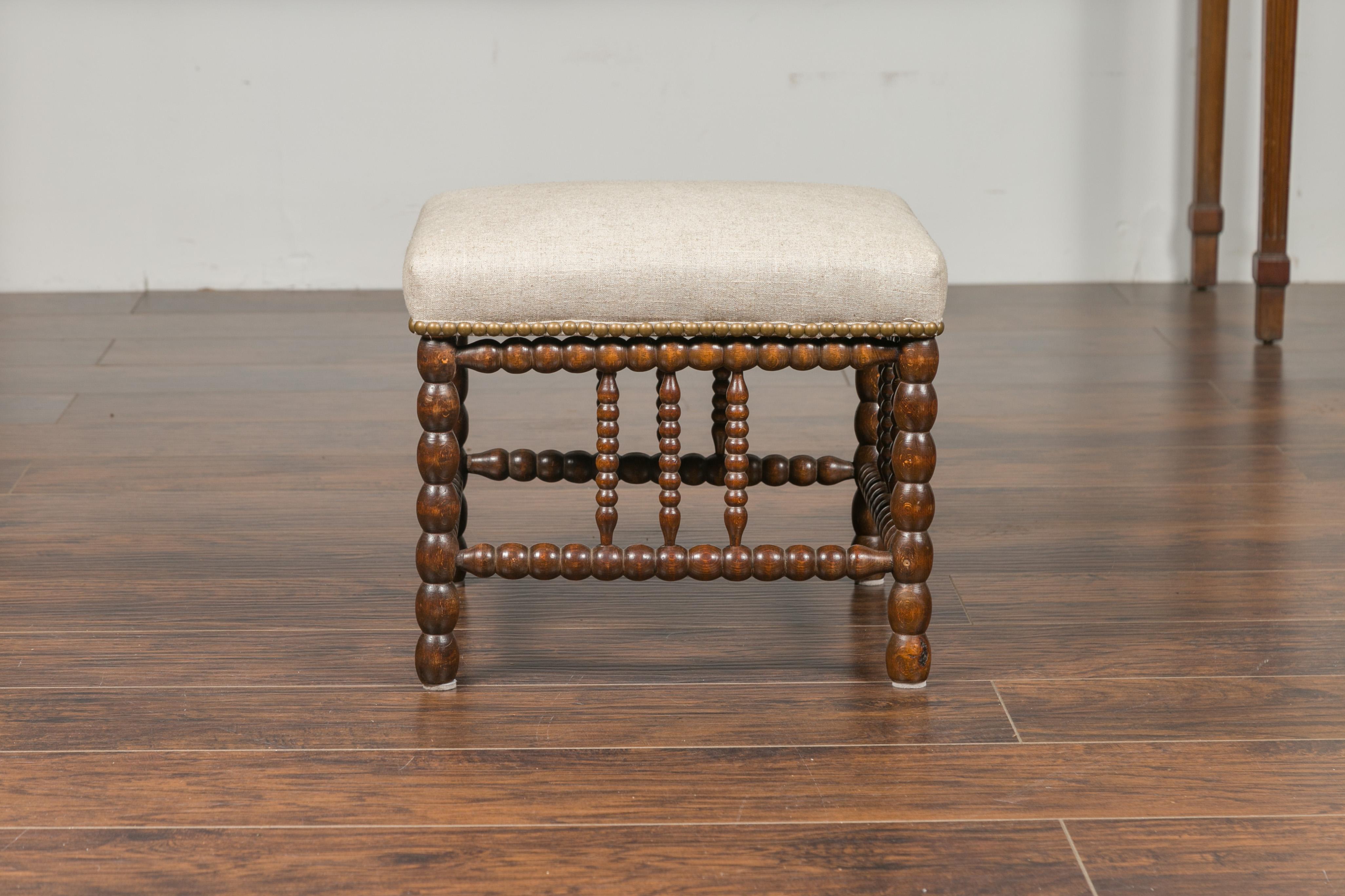 English 1900s Oak Footstool with Bobbin Legs, New Upholstery and Nailhead Trim 5