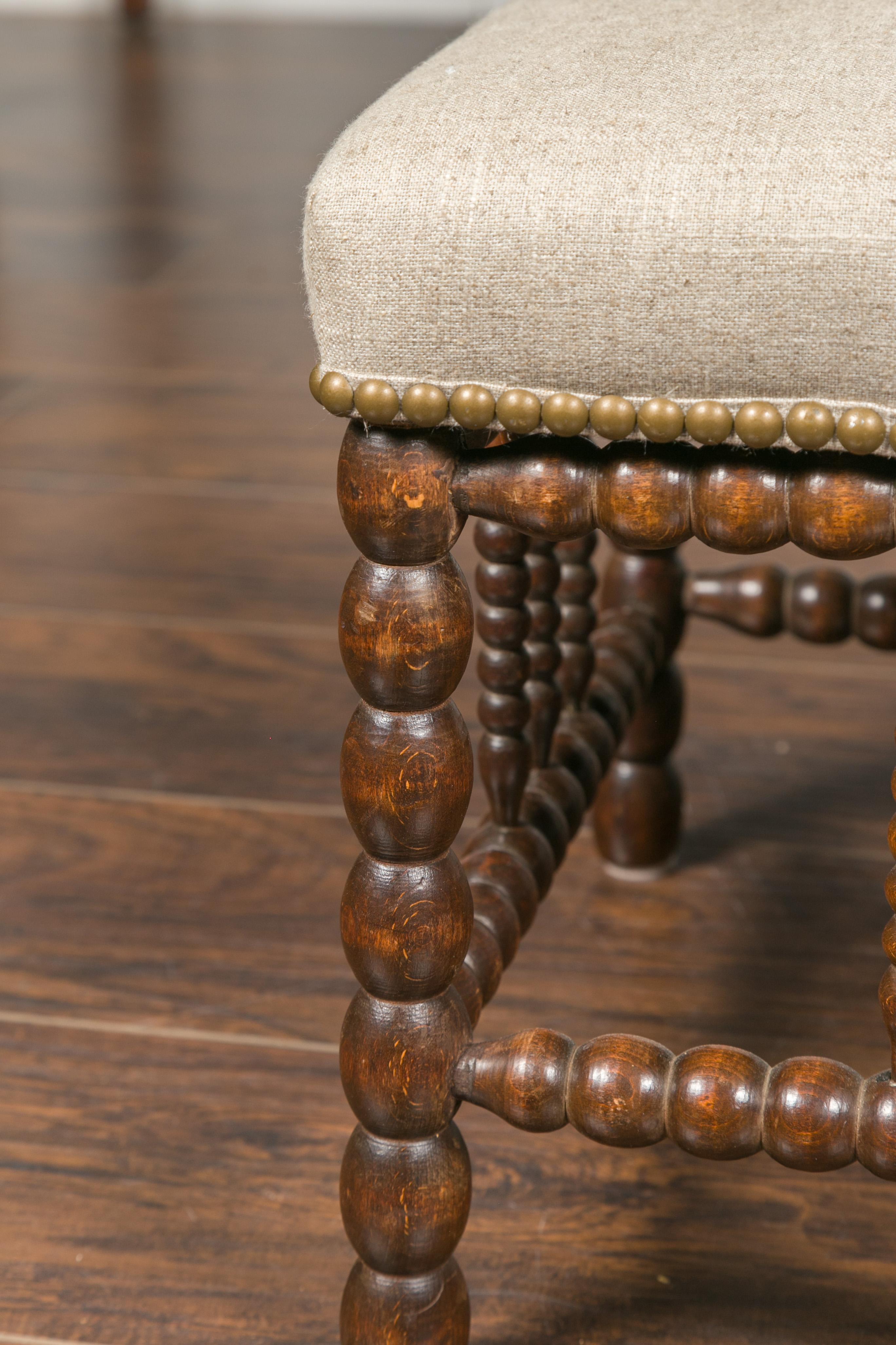 English 1900s Oak Footstool with Bobbin Legs, New Upholstery and Nailhead Trim 6