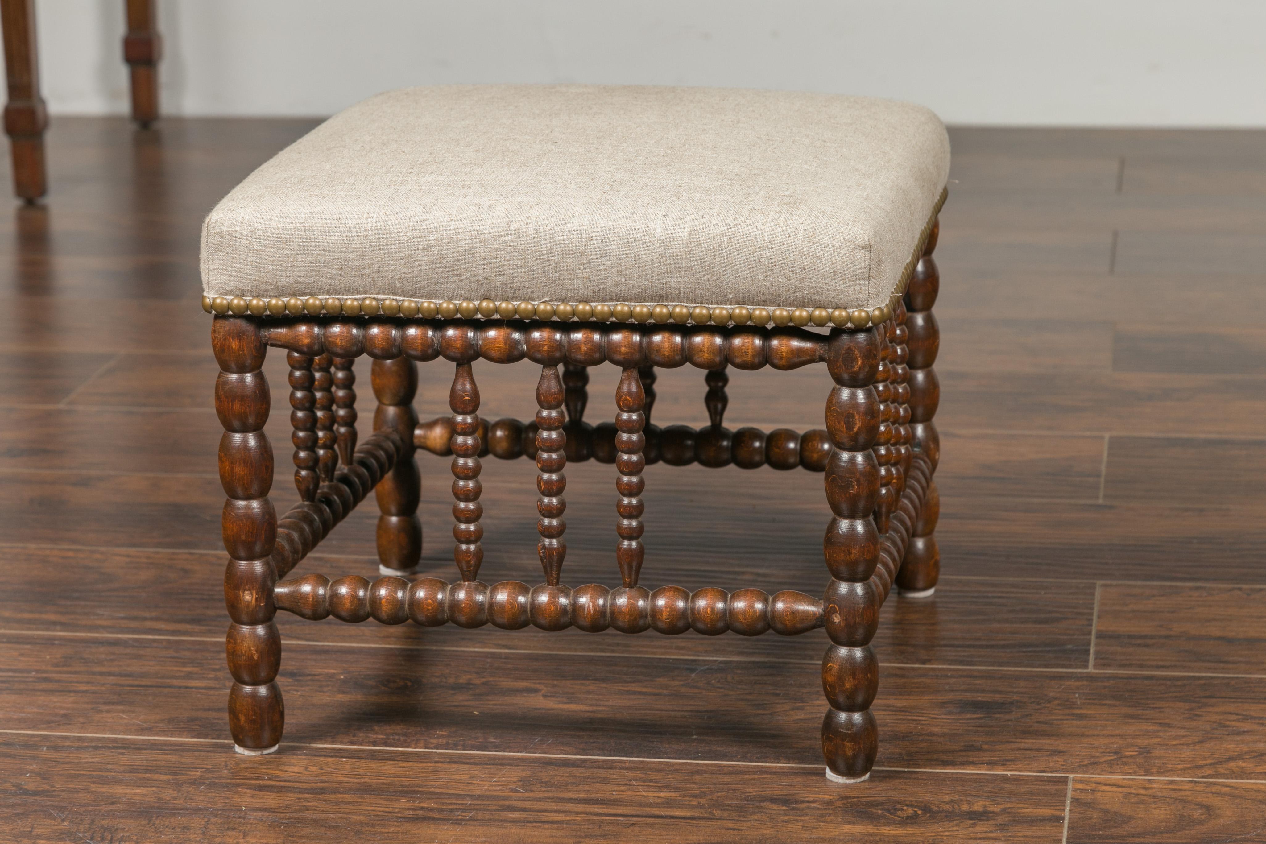 English 1900s Oak Footstool with Bobbin Legs, New Upholstery and Nailhead Trim In Good Condition In Atlanta, GA