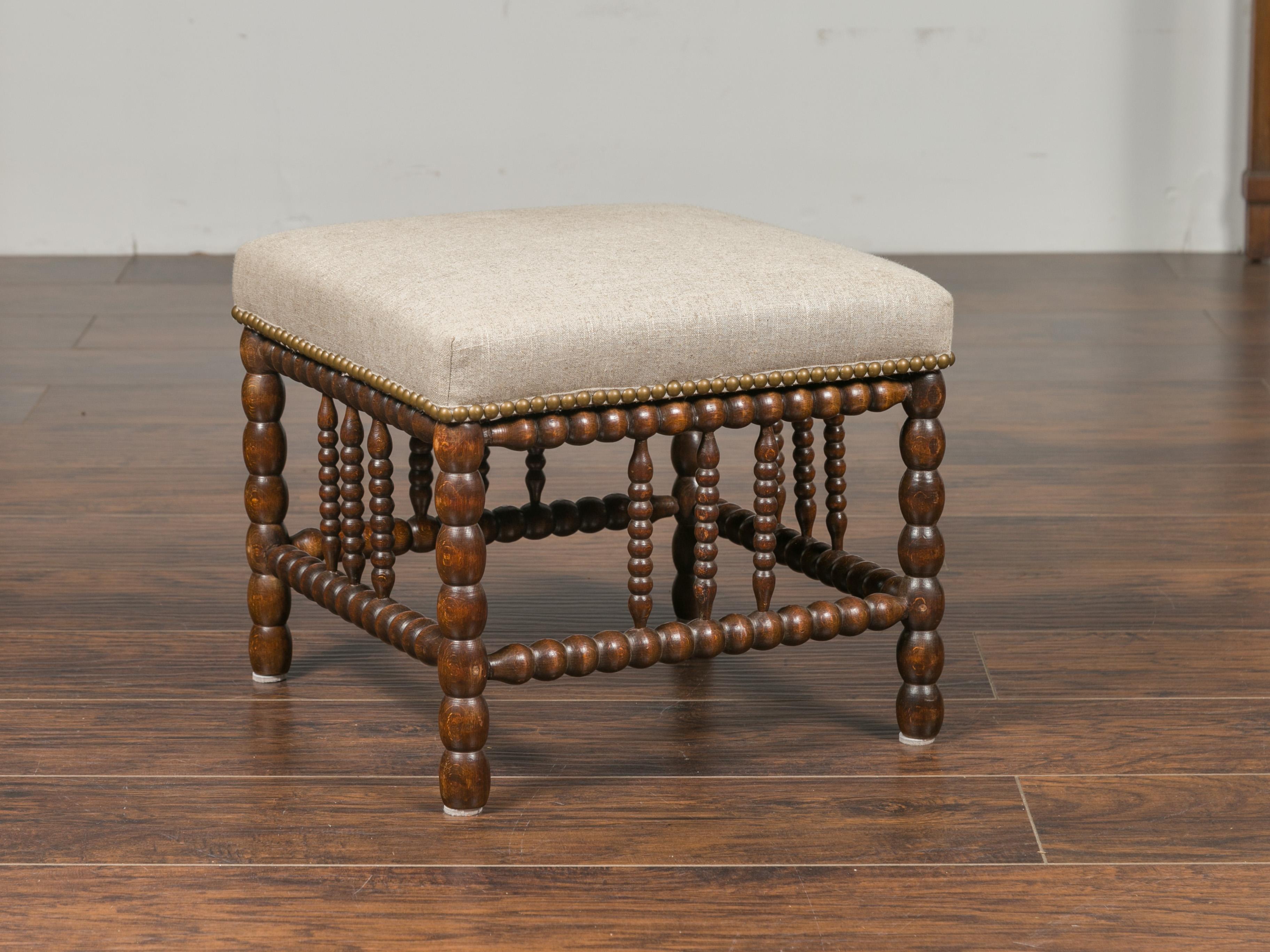 English 1900s Oak Footstool with Bobbin Legs, New Upholstery and Nailhead Trim 1
