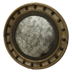 Miroir anglais des années 1900 en forme de œil de bœuf convexe en feuille d'argent avec accents ébénisés