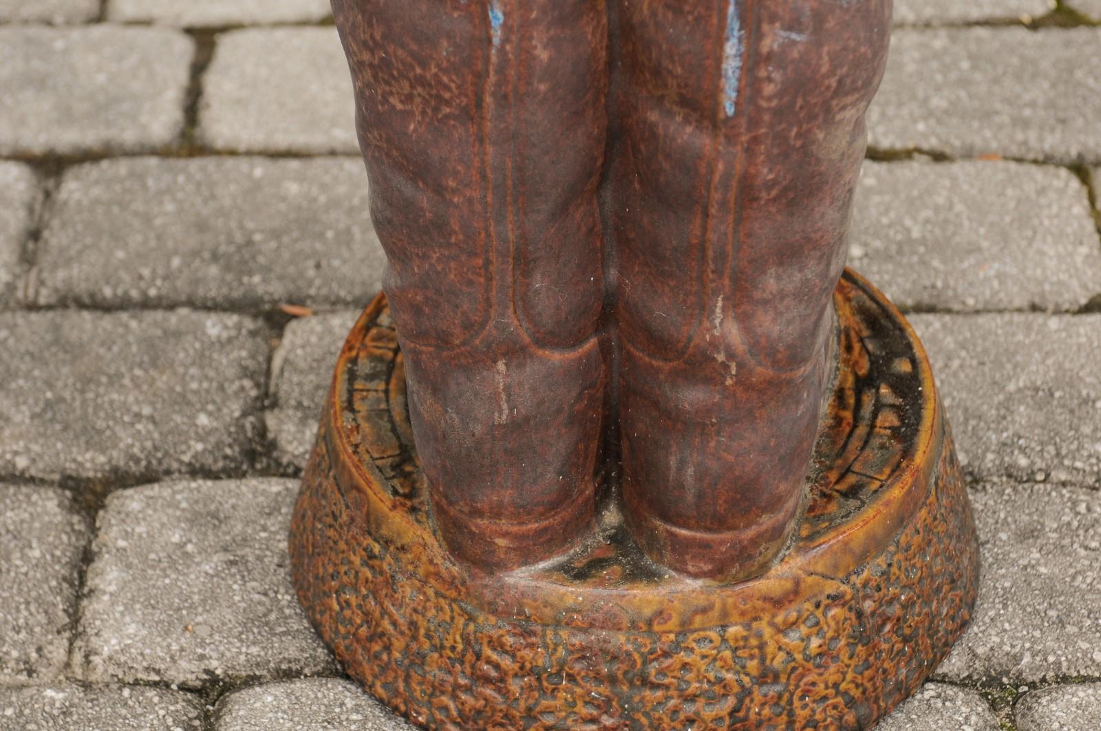 Terracotta Umbrella Stand Depicting a Pair of Brown Riding Boots on Base 1
