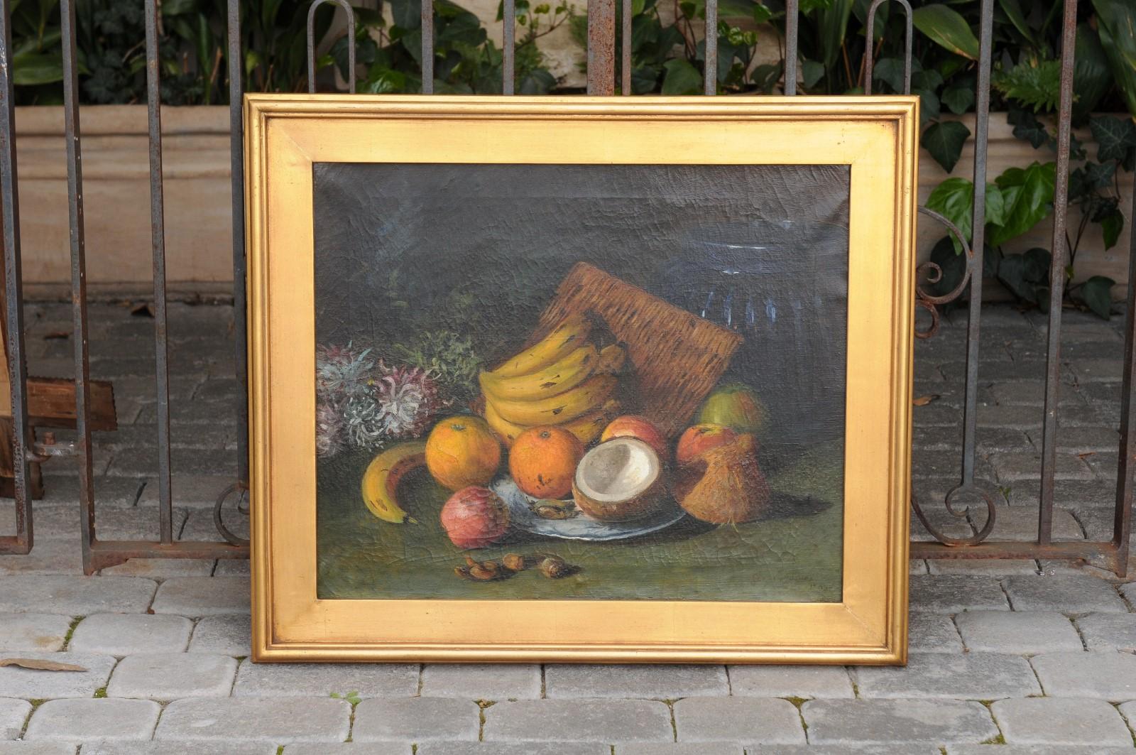 An English oil on canvas still-life painting from the early 20th century, by Elinor Jones and set inside a giltwood frame. Born in the first decade of the 20th century, this lovely still-life painting depicts an arrangement of fruits painted on a