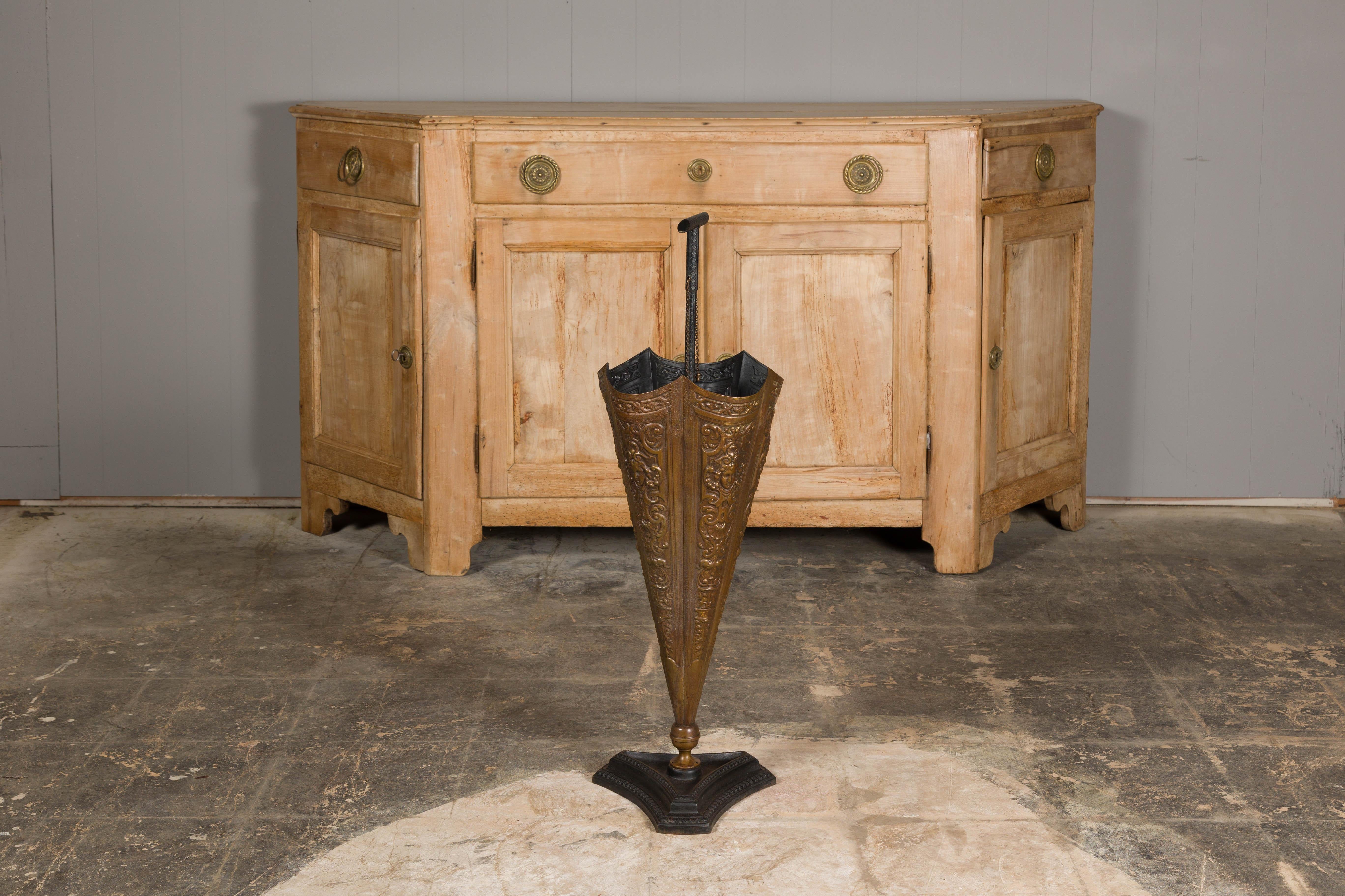 20th Century English 1920-1930 Brass Umbrella Stand with Raised Motifs and Tripartite Base For Sale