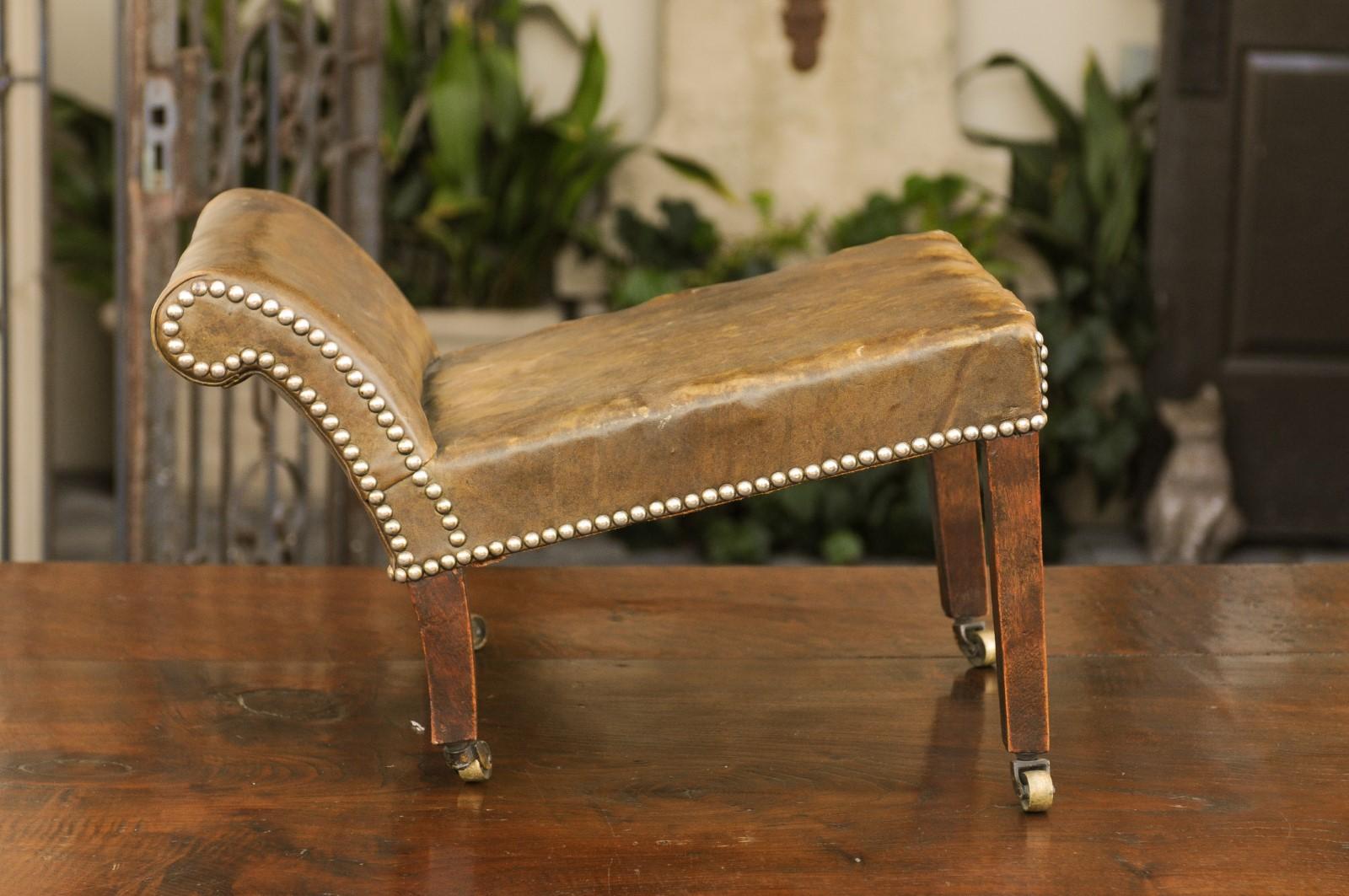 English 1920s Leather Gout Stool with Out-Scrolling Back, Nailheads and Casters In Good Condition In Atlanta, GA