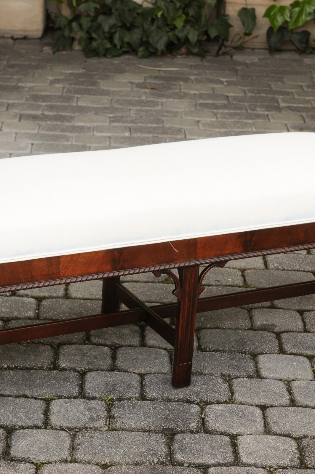 20th Century English 1920s Mahogany Upholstered Bench with Out-Scrolling Arms and Rosettes