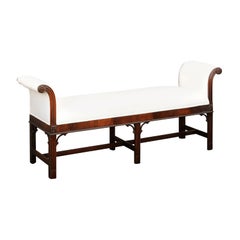 Antique English 1920s Mahogany Upholstered Bench with Out-Scrolling Arms and Rosettes