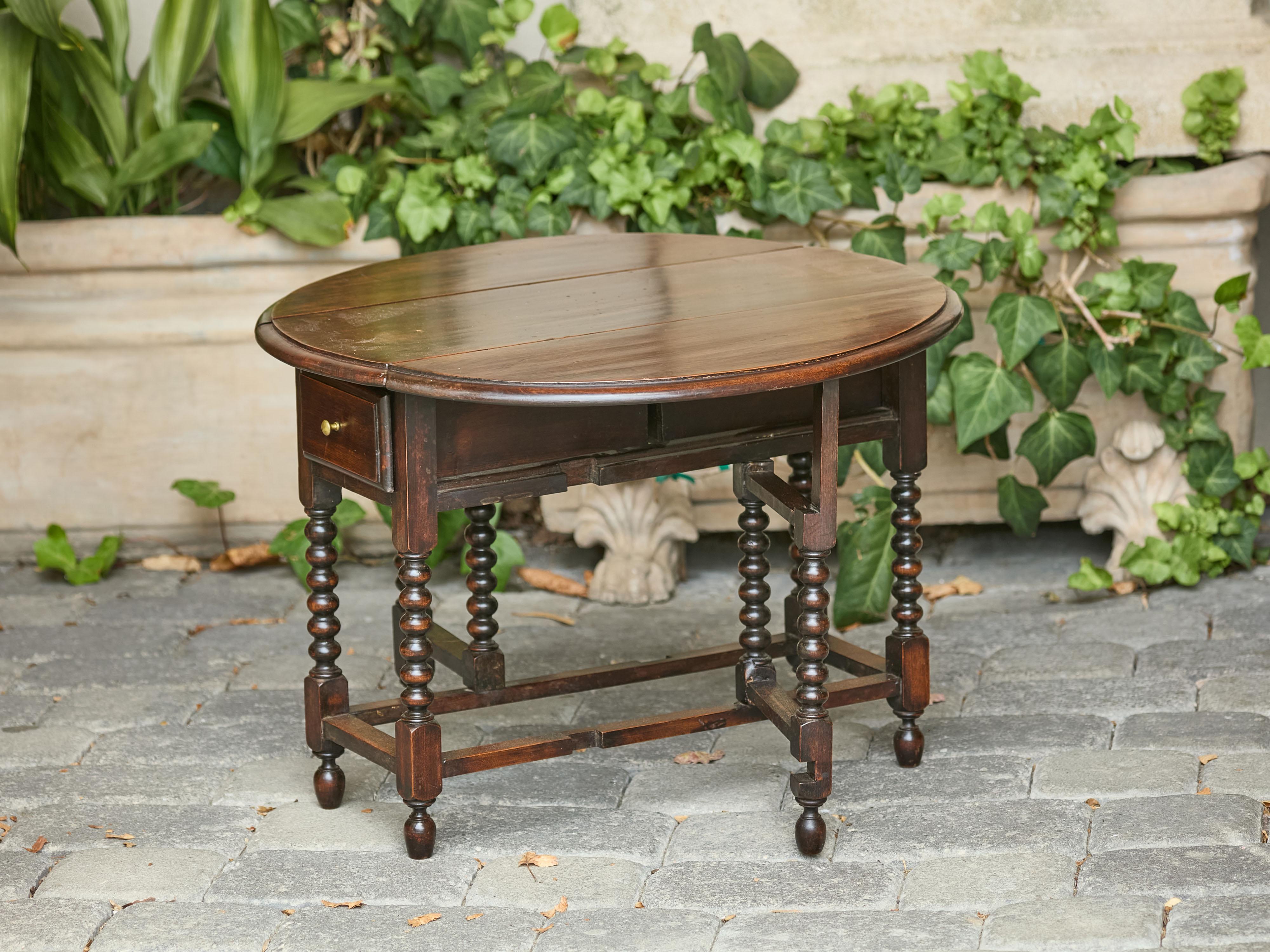Table à abattants anglaise des années 1920 avec pieds à bobine et tiroirs ultérieurs en vente 20