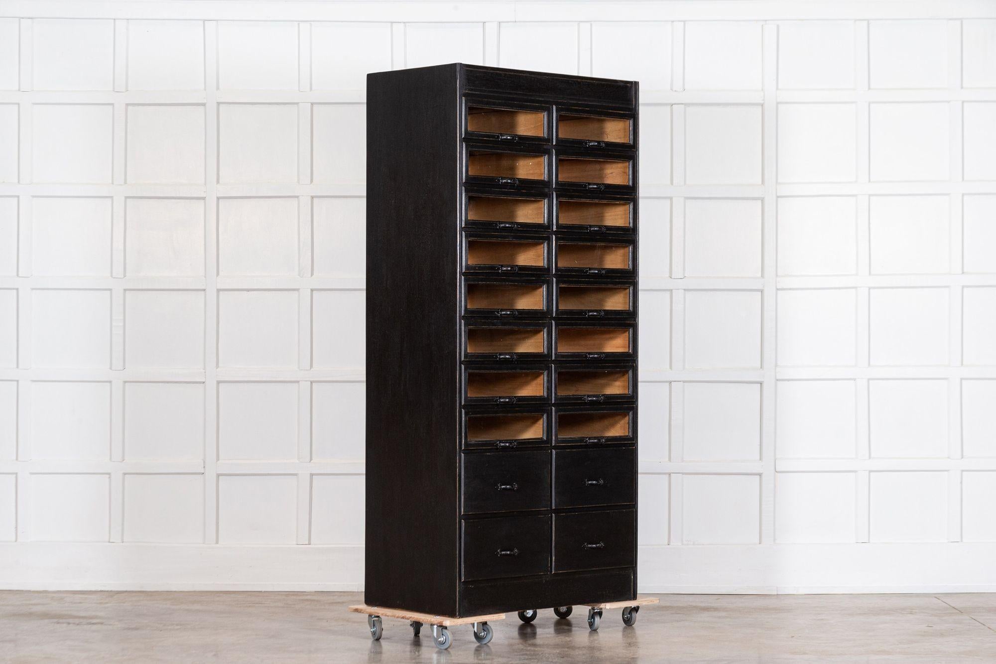 English 1920s painted haberdashery cabinet with glass drawers,
circa 1920.

20 drawers with 16 of the drawers having glass fronts whilst the larger drawers at the base having solid fronts. A versatile piece of storage, an ideal dressing room piece