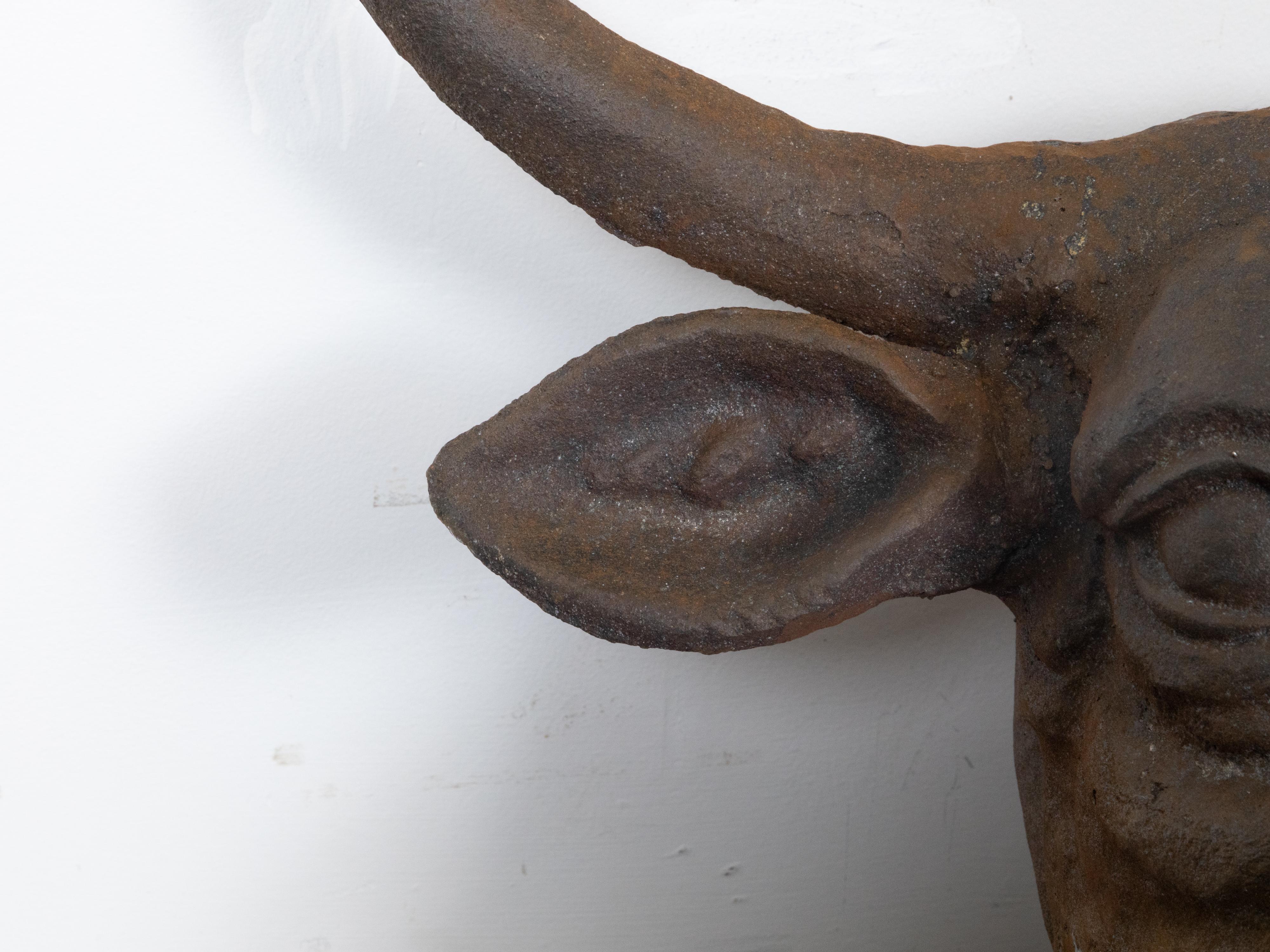 20th Century English 1930s-1940s Cast Iron Bull Wall Hanging Sculpture with Rusty Patina For Sale