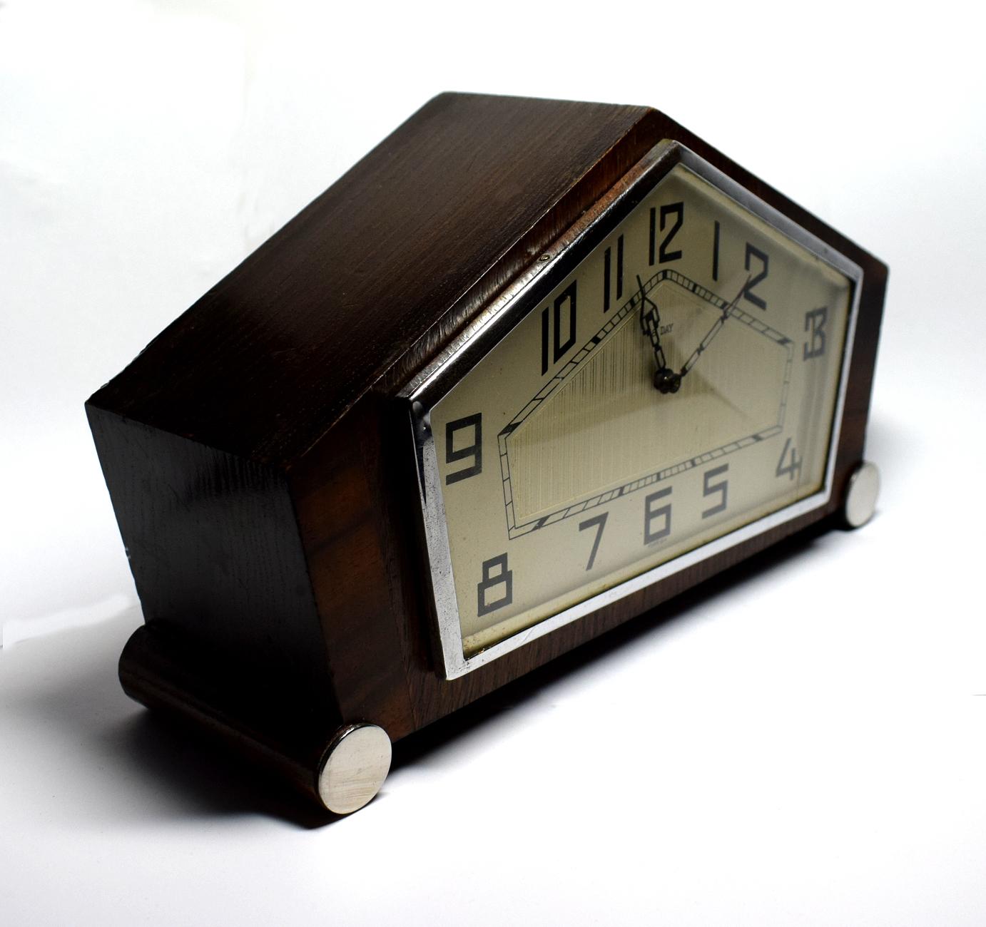 For your consideration is this very stylish Art Deco walnut clock. Originating from England and dating to the 1930s this clock can't be mistaken for any other era can it. The silvered dial which is in excellent condition is the back drop to very