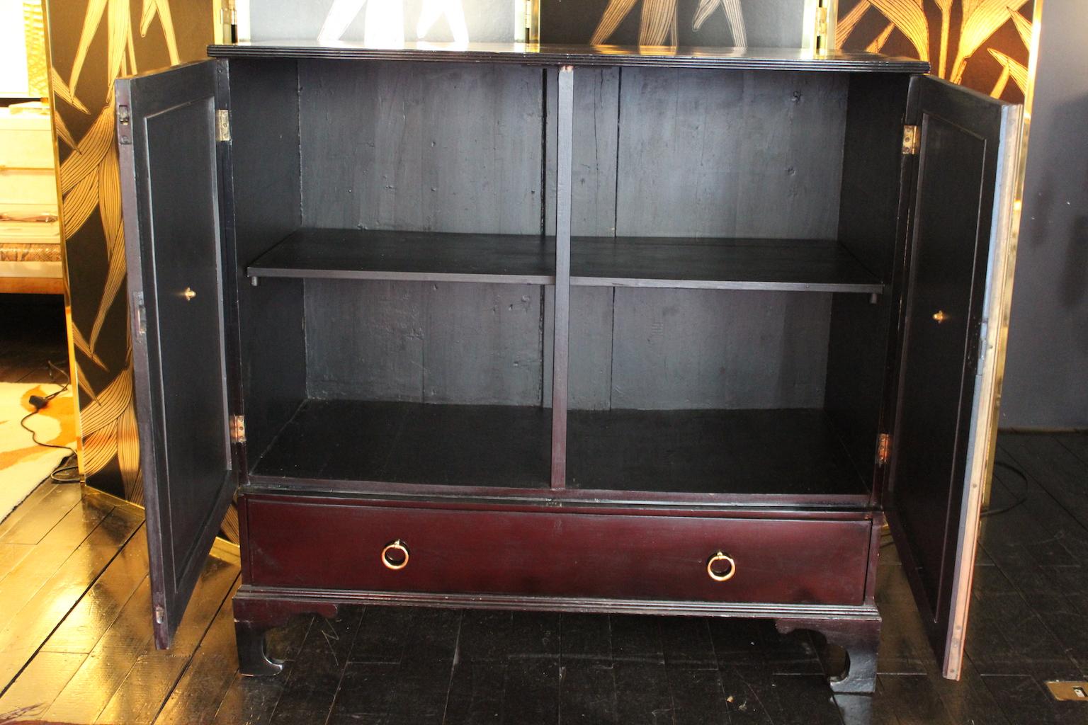 English 1940 cupboard with drawer in black walnut and brass.
