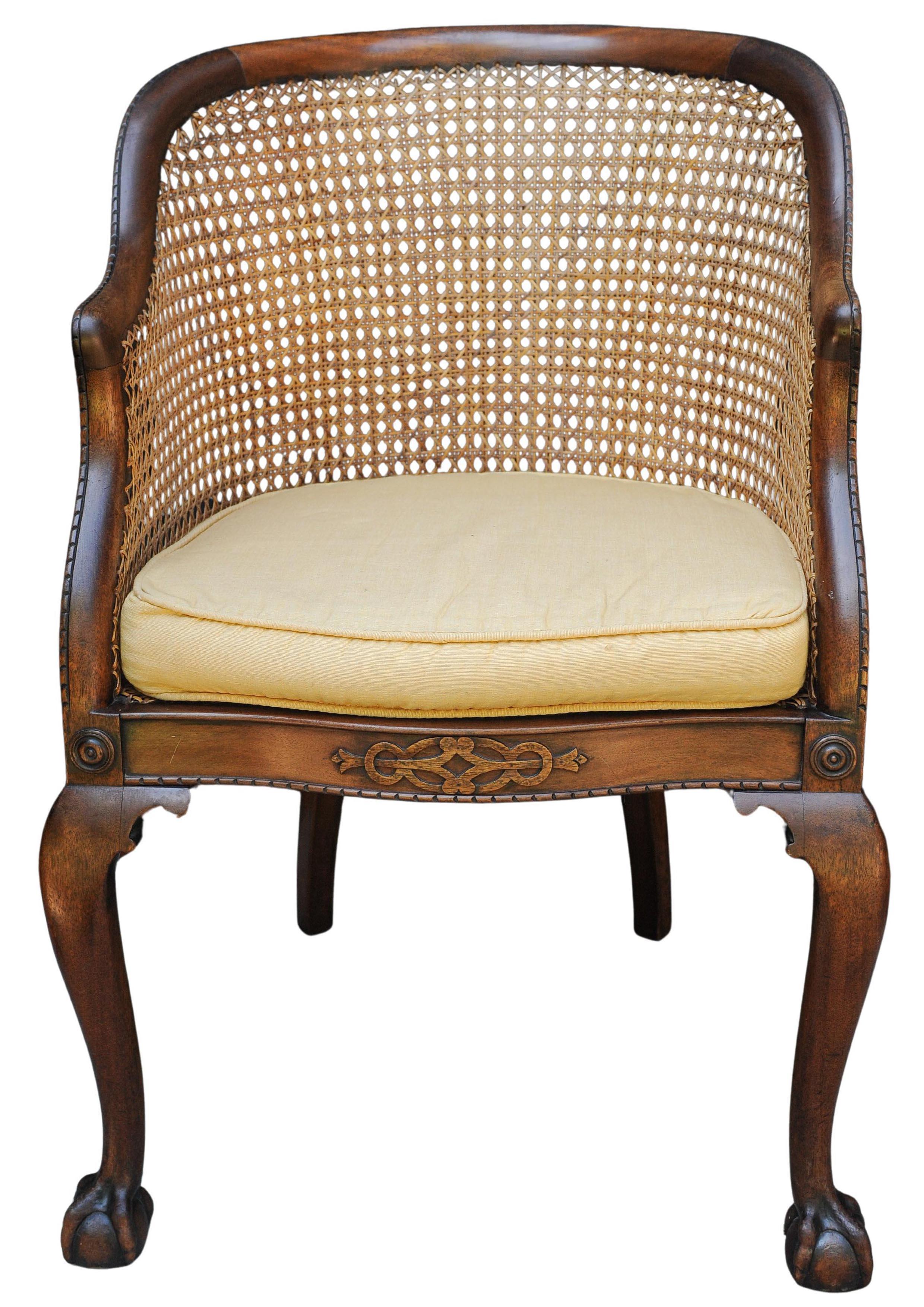 A Thomas Chippendale Design Style English Antique Mahogany Frame Cane Bergere Armchair On Claw & Ball Feet With A Squab Cushion

Extra dimensions 
Height to seat cane 42cm
Height to seat cushion 48cm
Width of seat 45cm
Depth of seat 47cm