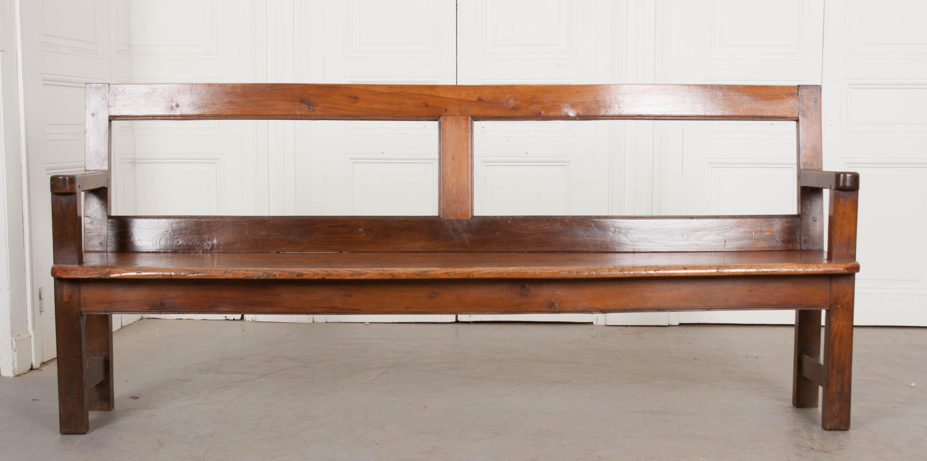 This handsome Arts & Crafts oak bench, circa 1880s, is from England. The geometric form and darker finish is typical of the period and it has a rich patina!