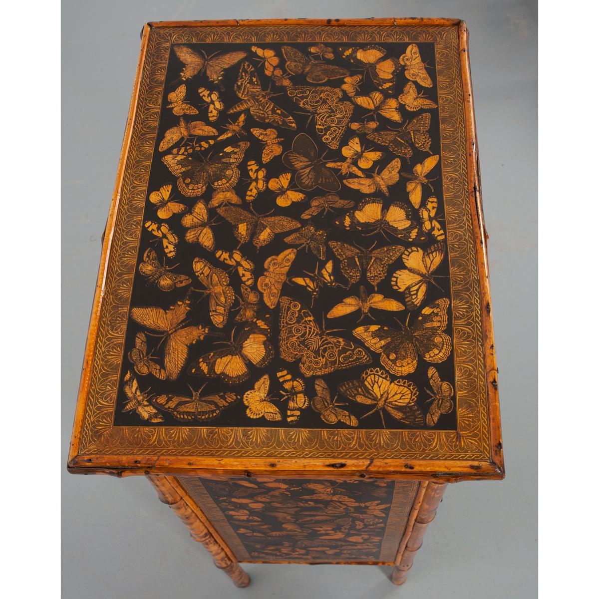 A wonderful bamboo cabinet with a single drawer and door. The drawer has a bail pull and the door has a simple knob. It has been recently découpaged with a moth and butterfly motif and decorative border on the front, sides and top. The door closes