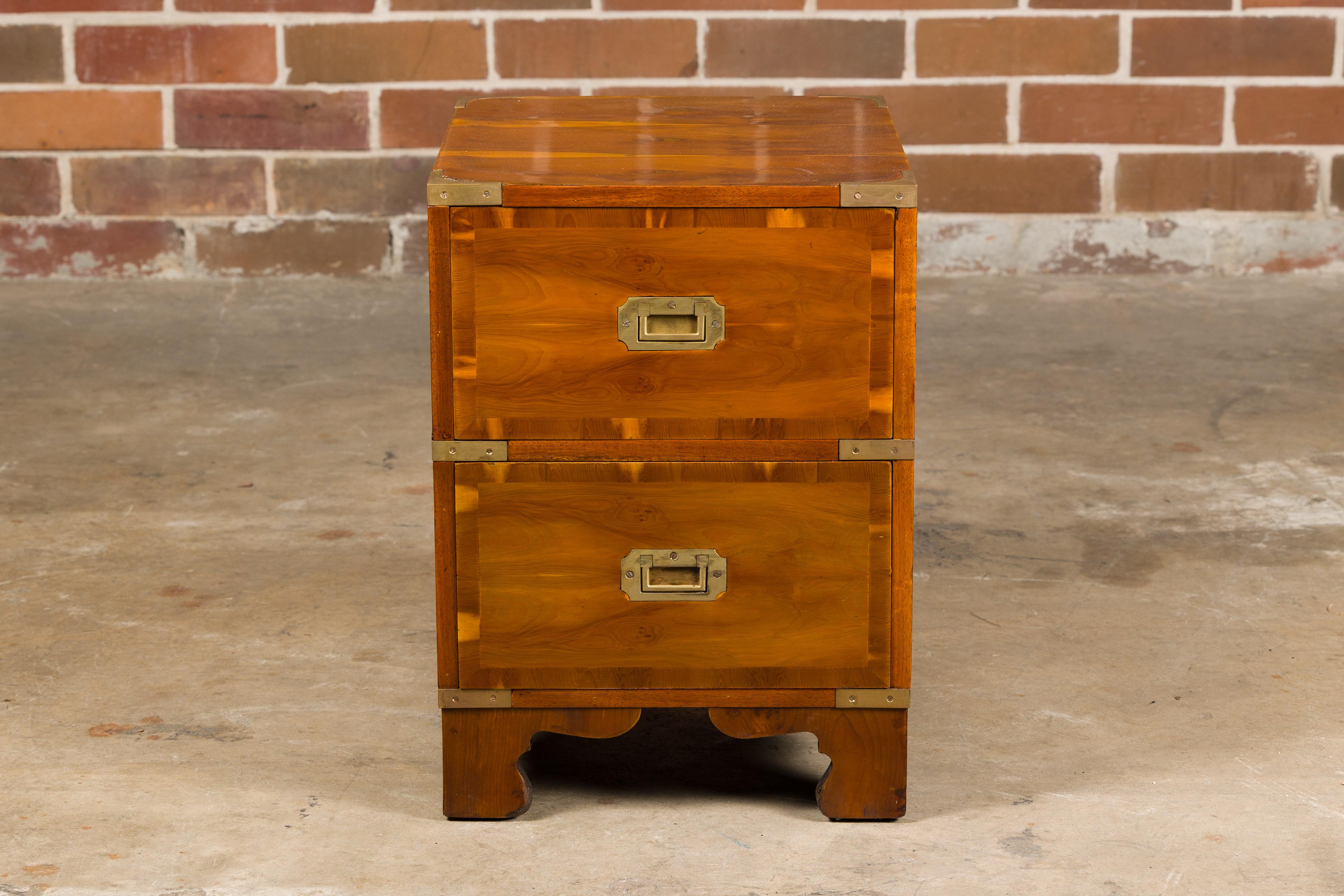 A small English 19th century Campaign chest by Bissitt & Brunton LTD, with two drawers, brass hardware and bracket feet. This charming small English 19th-century Campaign chest, crafted by the renowned Bissitt & Brunton LTD, is a piece brimming with