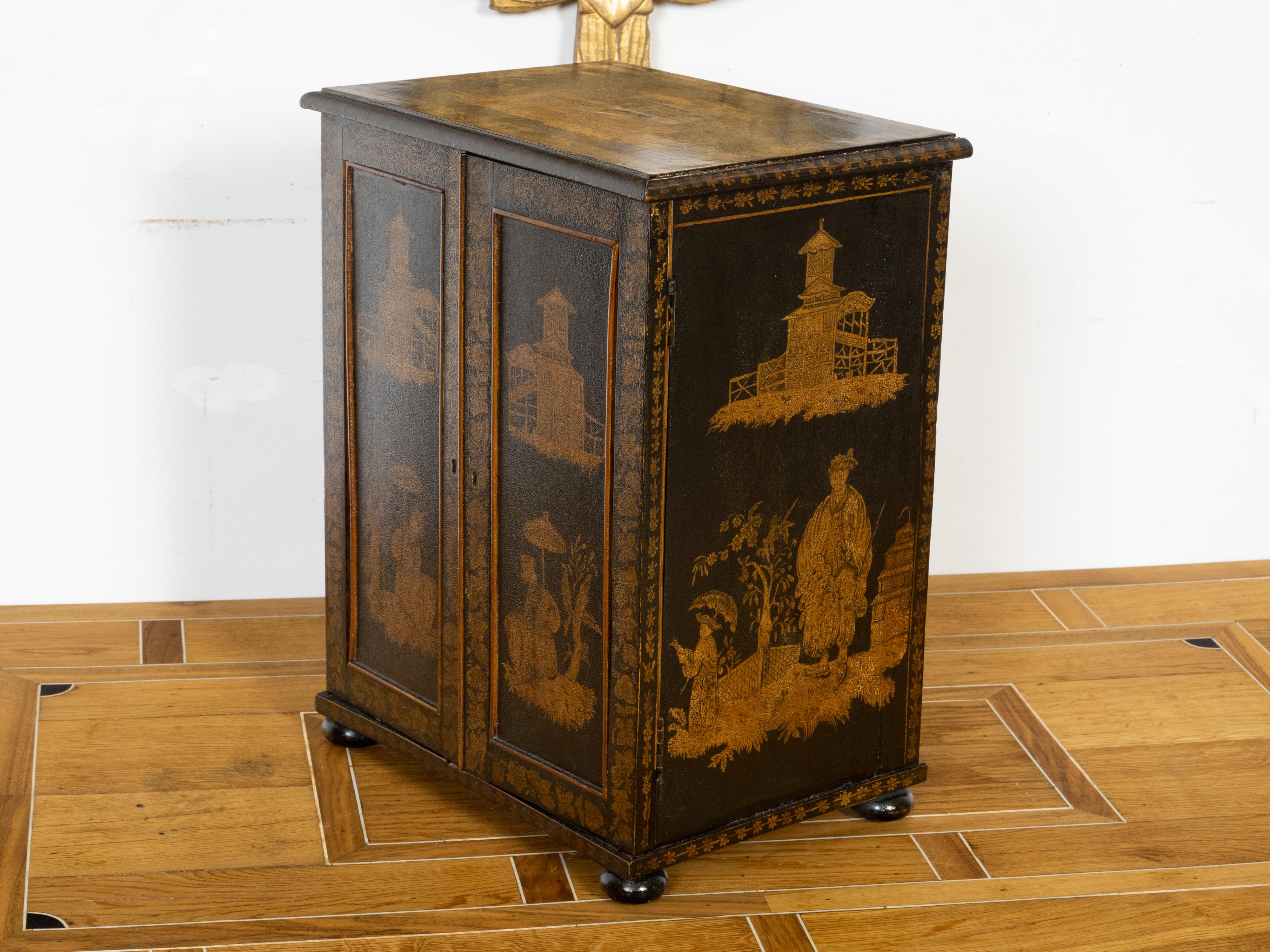 English 19th Century Black and Gold Chinoiserie Cabinet with Seven Drawers In Good Condition For Sale In Atlanta, GA