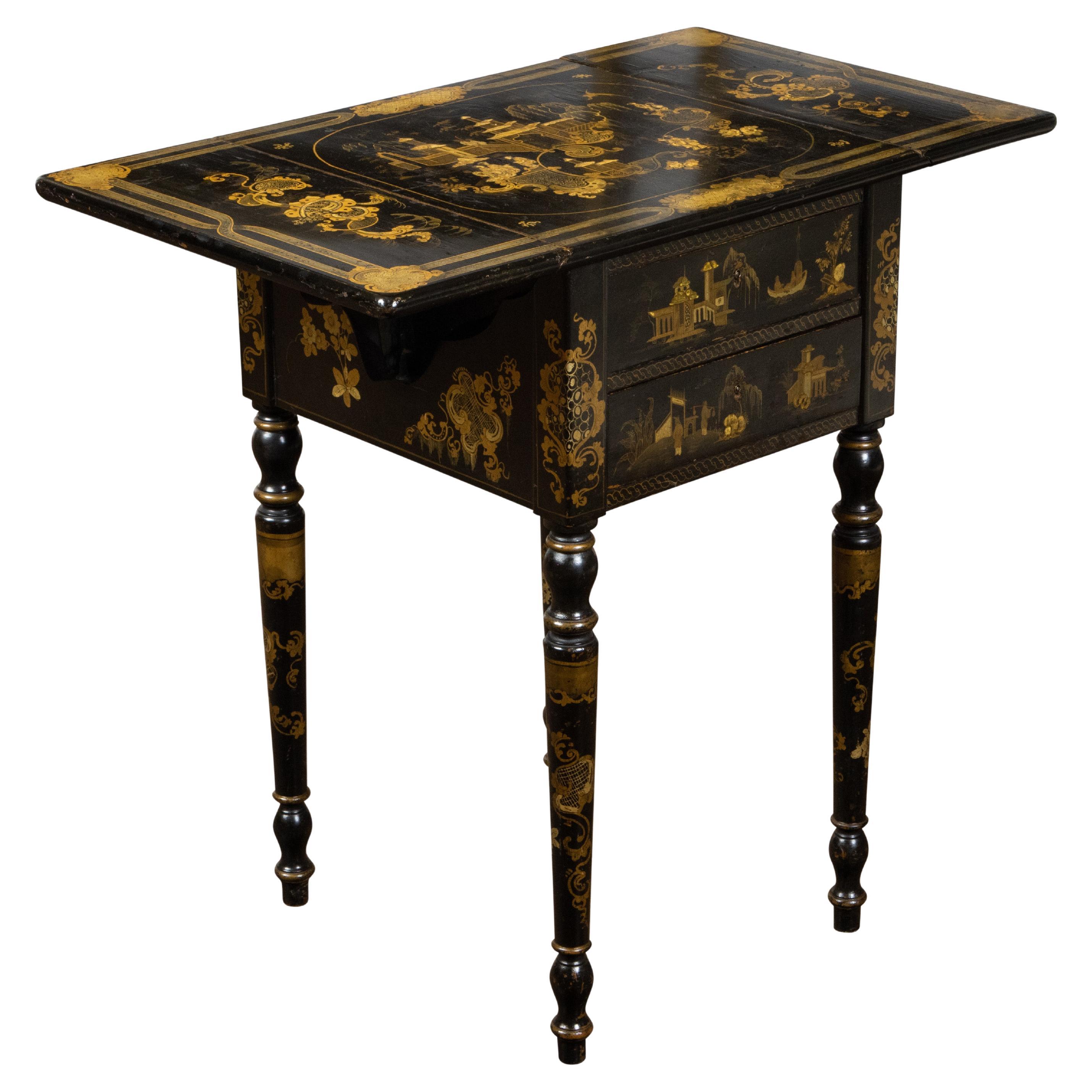 An English black and gold Pembroke side table from the 19th century, with Chinoiserie décor and drop leaves. Created in England during the 19th century, this table features a rectangular top with two drop leaves, sitting above an elegant apron.