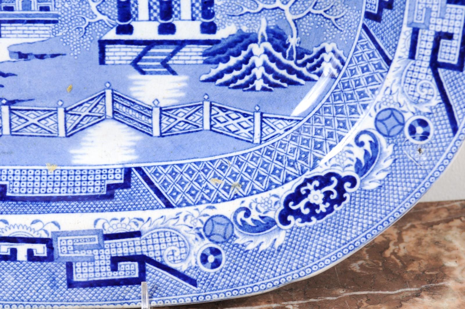 English 19th Century Blue and White Chinoiserie Stoneware Willow Pattern Platter In Good Condition In Atlanta, GA
