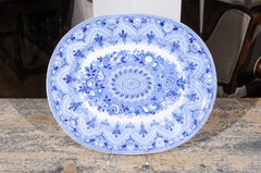 English 19th Century Blue and White Pearlware Oval Platter with Floral Motifs