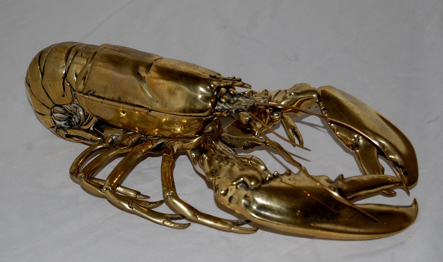 
  English 19th century brass full bodied lobster inkwell with hinged carapace that when opened reveals two blown glass inkwells.  This rare inkwell is registry dated 1889 and is superbly crafted and detailed.  Its large size also makes a design