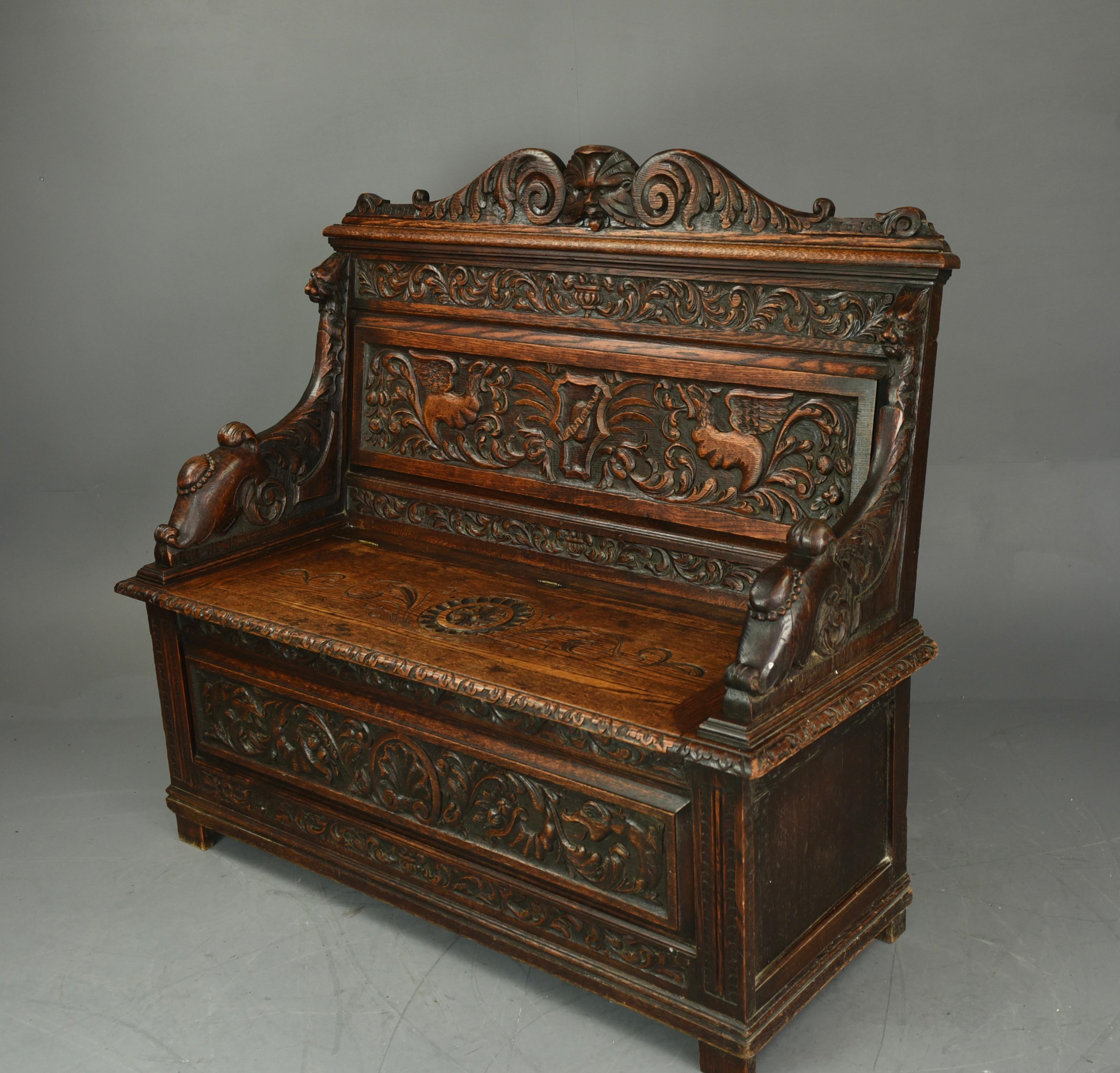 English 19th Century Carved Oak Box Settle Bench at 1stDibs