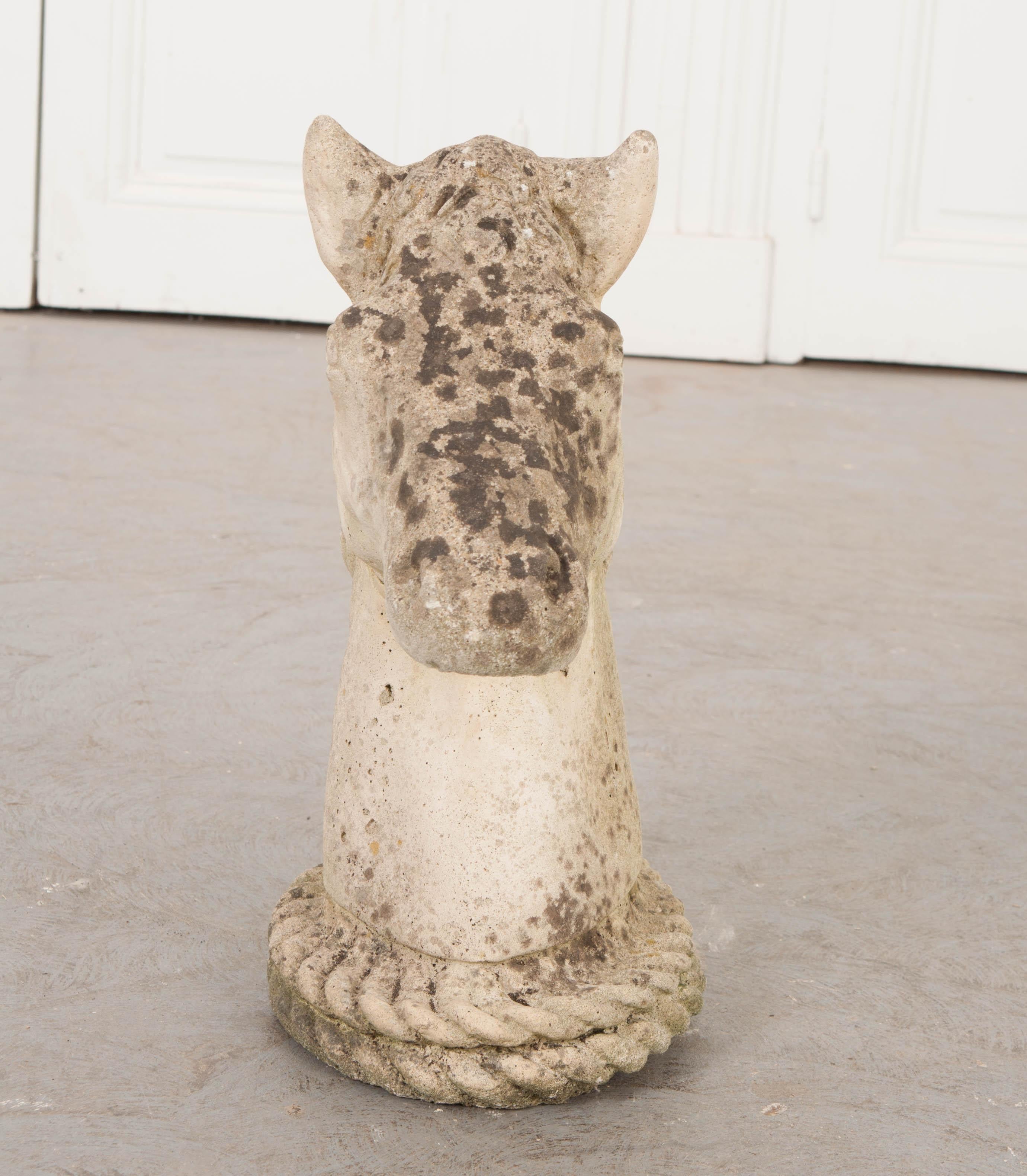 This beautifully aged English stone horse head, circa 1880s, likely one of a pair mounted atop the entry posts of a stone wall, would make a great decorative element outdoors or as an indoor sculptural piece.
