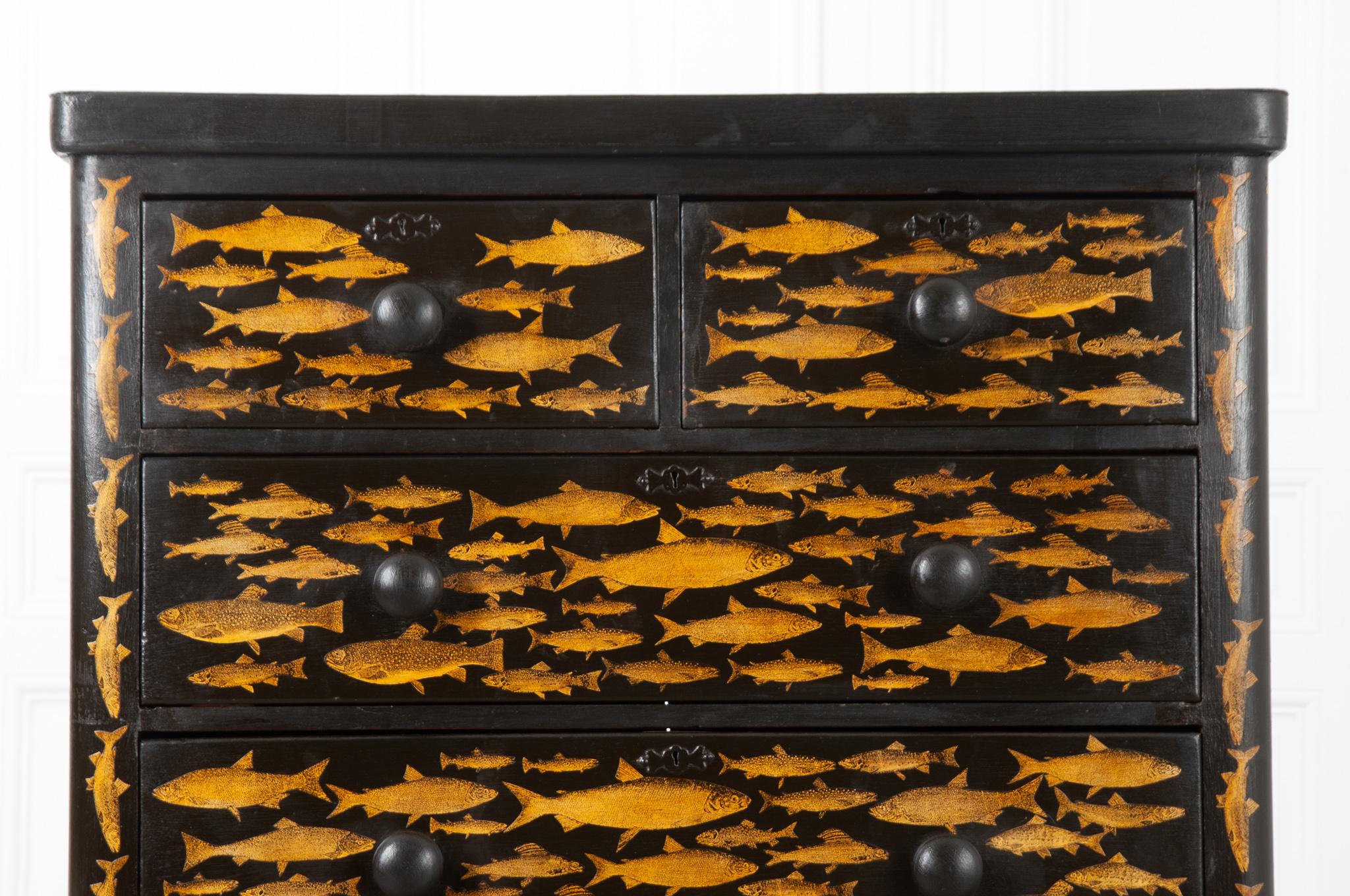 A playful twist on an antique pine chest of drawers. Recently painted black with a fish decoupage design. This chest will add a whimsical flair to any room in your house, especially a bedroom as there is plenty of storage inside its five drawers all
